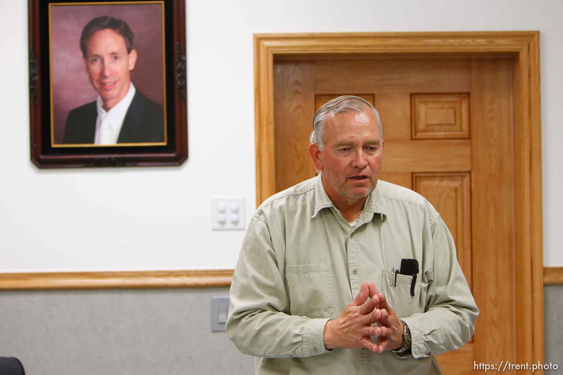 Lamar Johnson in his home on the YFZ Ranch Wednesday, April 16, 2008, talks about his children, taken in the raid. On the wall are portraits of FLDS leaders Warren Jeffs, Wendell Nielsen and Fred Jessop..  Wednesday April 16, 2008.