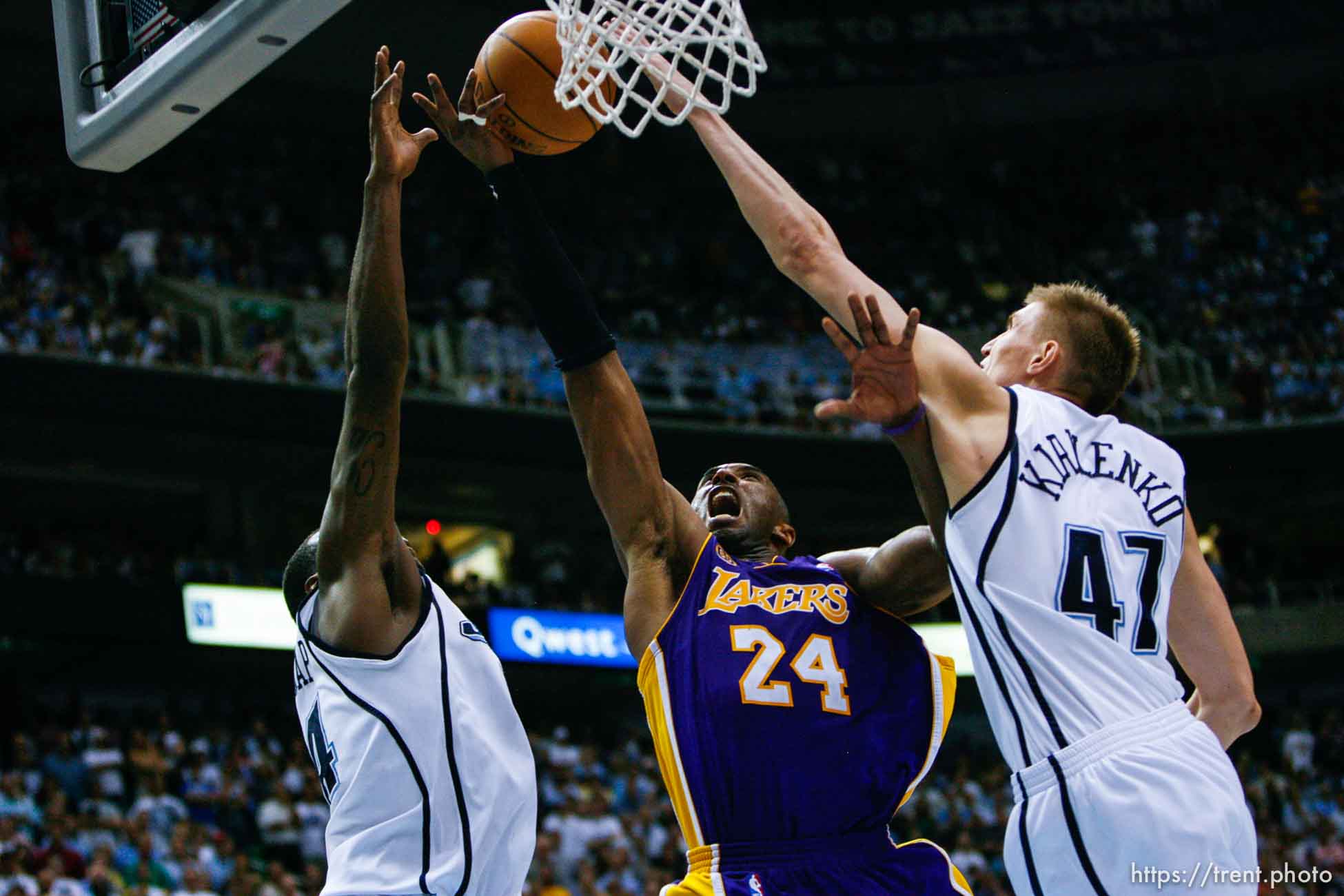 Salt Lake City - Los Angeles Lakers guard Kobe Bryant  (24) drives on Utah Jazz forward Paul Millsap (24) and Utah Jazz forward Andrei Kirilenko (47). Utah Jazz vs. Los Angeles Lakers, game six, NBA playoffs second round, Friday, May 16, 2008.