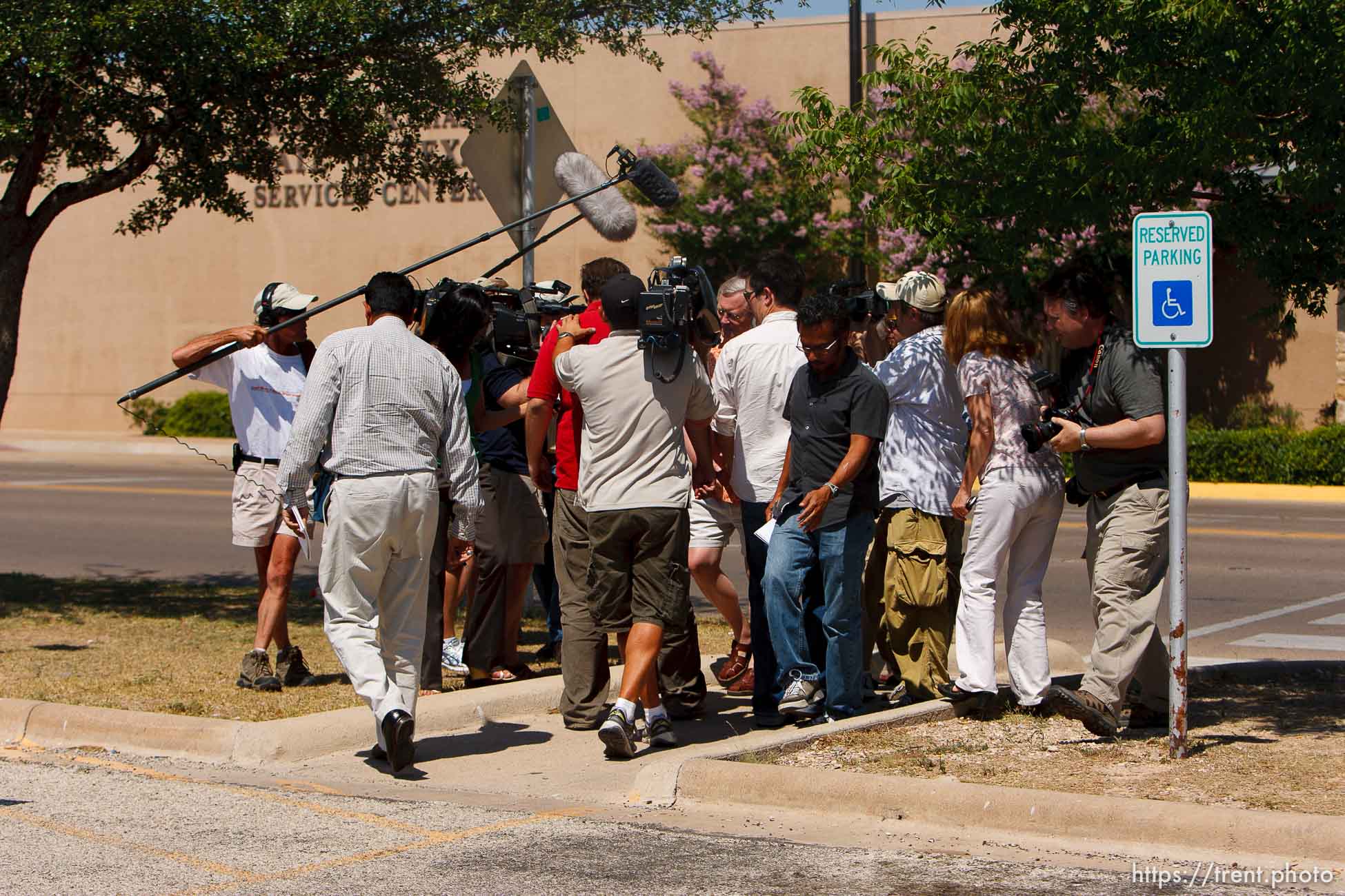 San Angelo - Attorney Jimmy Stewart is chased to his car by reporters as left a gathering of attorneys at the DFPS at the Ralph R. Chase building Sunday, June 1, 2008 to hammer out an agreement to return over 450 children that were taken from the YFZ ranch.