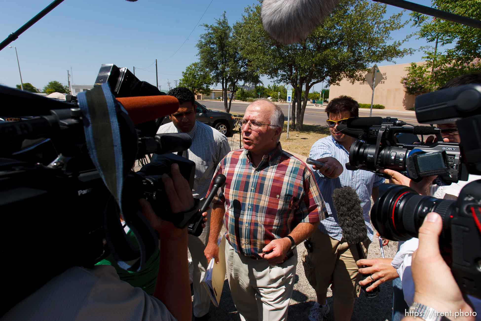 San Angelo - Attorney Jimmy Stewart is chased to his car by reporters as left a gathering of attorneys at the DFPS at the Ralph R. Chase building Sunday, June 1, 2008 to hammer out an agreement to return over 450 children that were taken from the YFZ ranch.