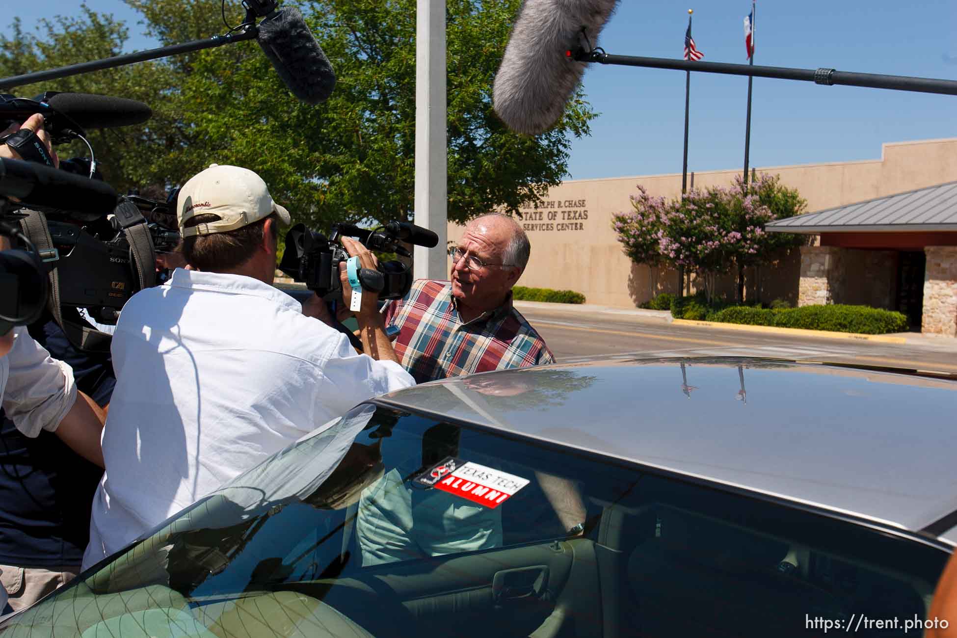 San Angelo - Attorney Jimmy Stewart is chased to his car by reporters as left a gathering of attorneys at the DFPS at the Ralph R. Chase building Sunday, June 1, 2008 to hammer out an agreement to return over 450 children that were taken from the YFZ ranch.