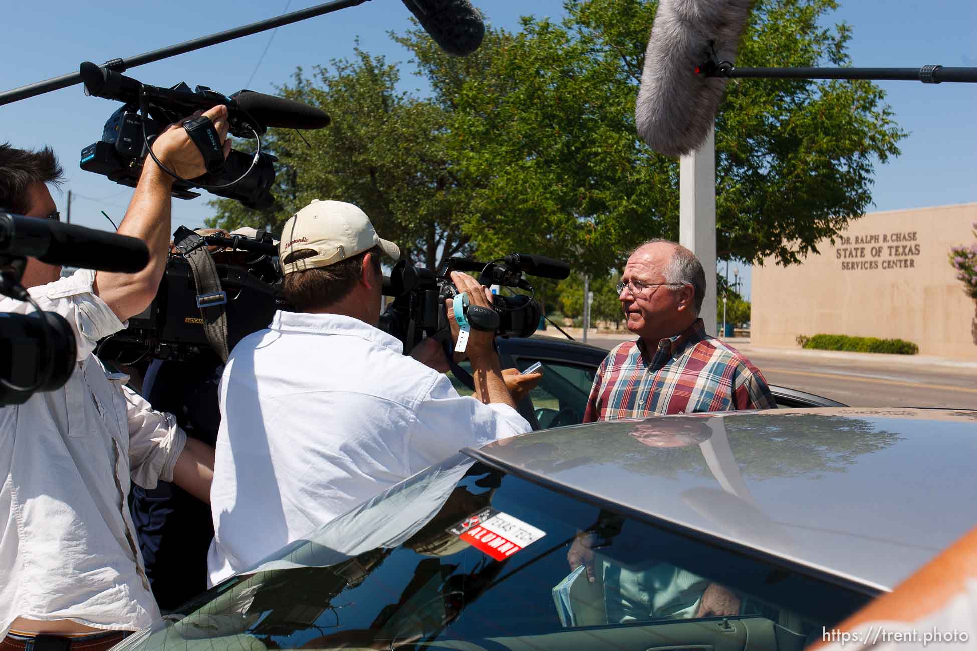 San Angelo - Attorney Jimmy Stewart is chased to his car by reporters as left a gathering of attorneys at the DFPS at the Ralph R. Chase building Sunday, June 1, 2008 to hammer out an agreement to return over 450 children that were taken from the YFZ ranch.