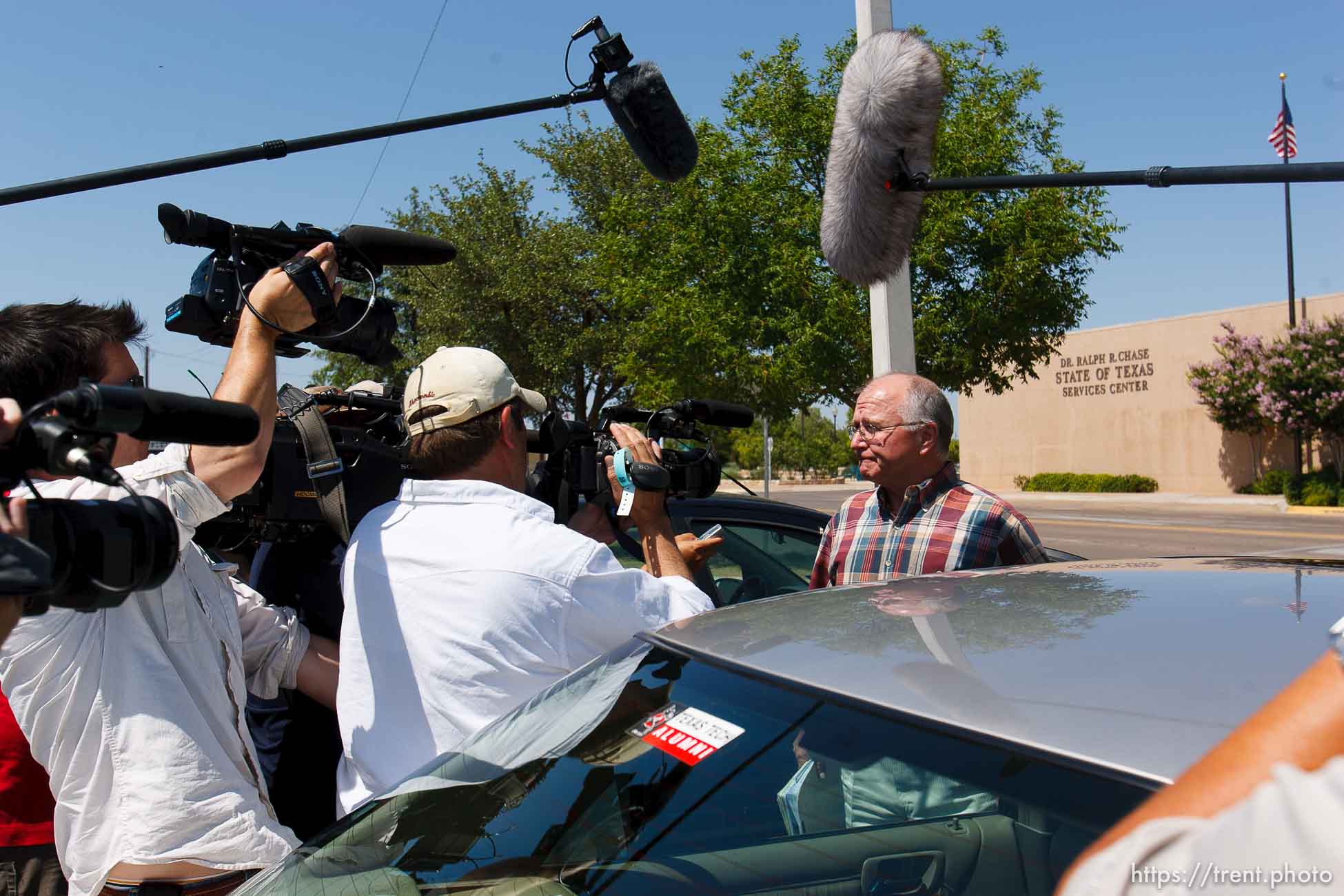 San Angelo - Attorney Jimmy Stewart is chased to his car by reporters as left a gathering of attorneys at the DFPS at the Ralph R. Chase building Sunday, June 1, 2008 to hammer out an agreement to return over 450 children that were taken from the YFZ ranch.