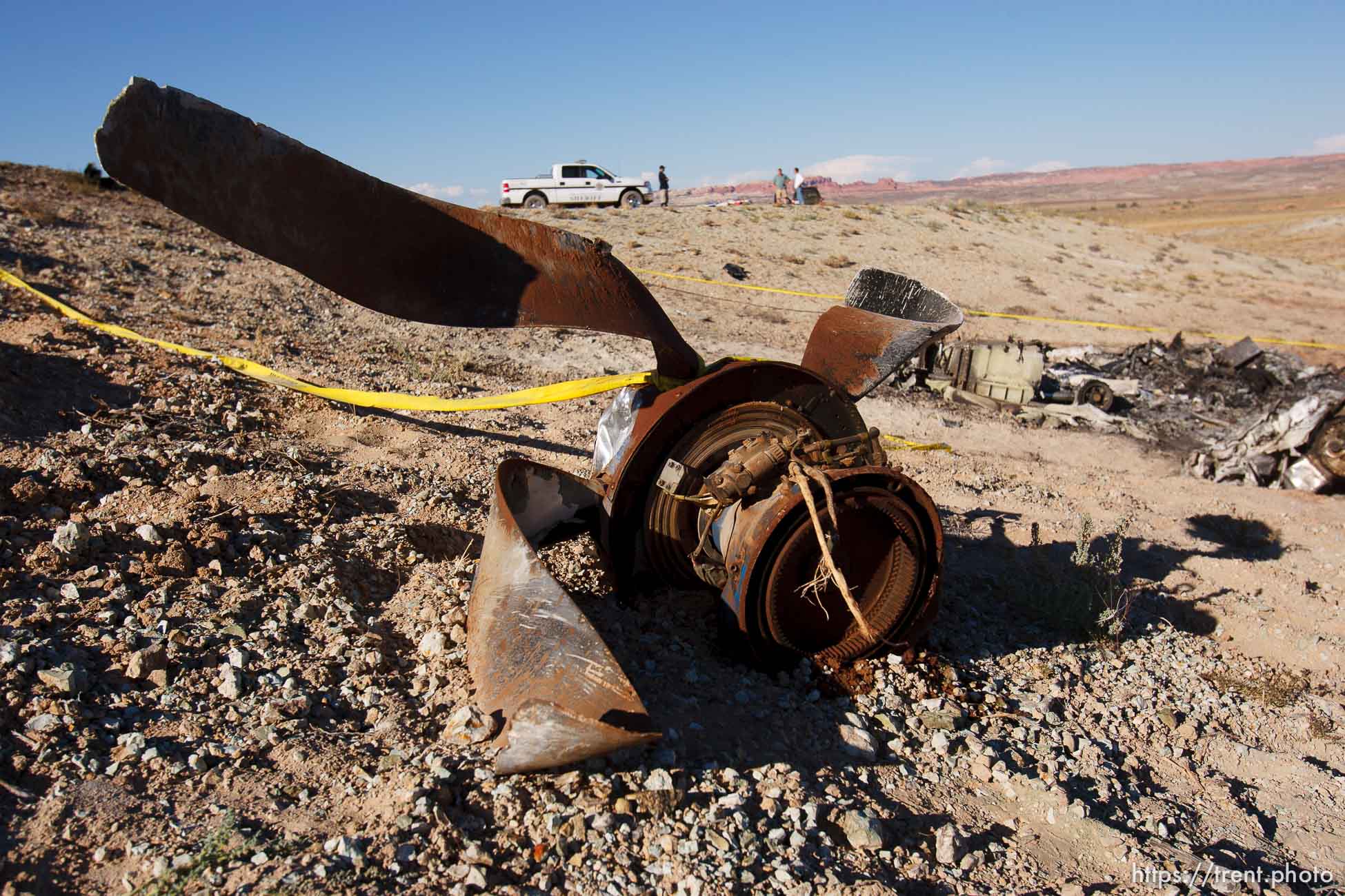 A Grand County Sheriff's Deputy stands guard at the crash site of a small plane that killed ten near the Canyonlands airport north of Moab Saturday, August 23, 2008.