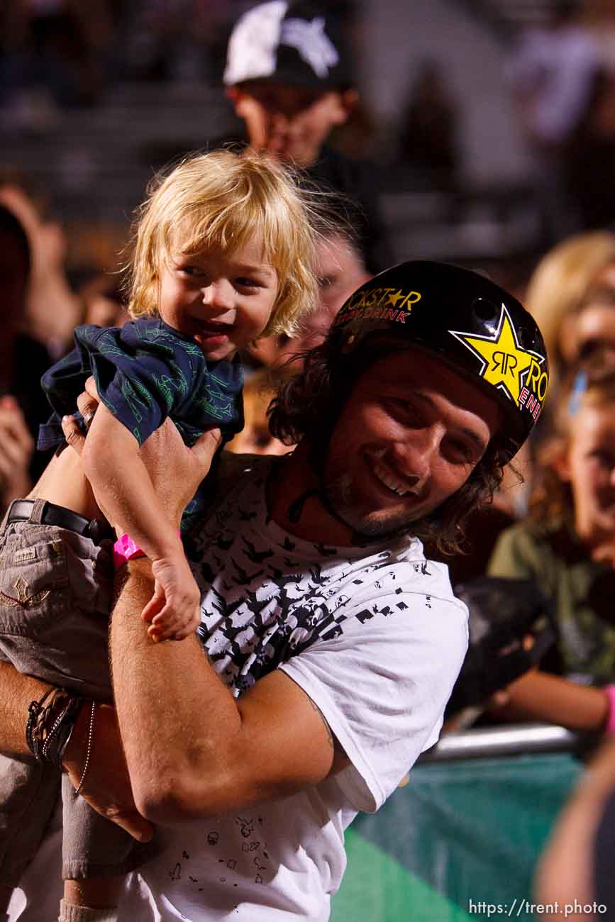 Salt Lake City - Mike Aitken high-fives his 1-year-old son Owen, BMX Dirt, AST Dew Tour, Friday September 12, 2008.