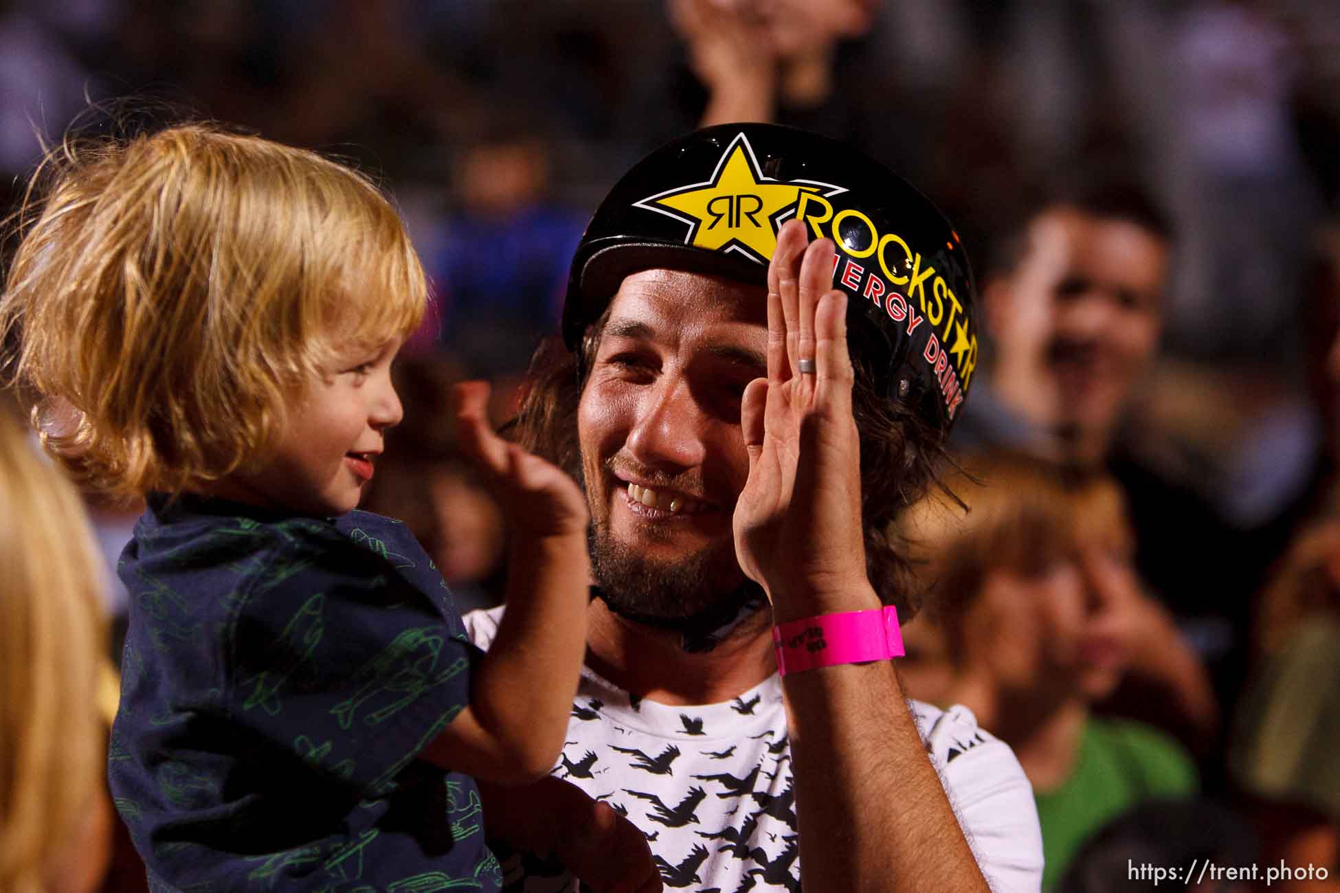 Salt Lake City - Mike Aitken high-fives his 1-year-old son Owen, BMX Dirt, AST Dew Tour, Friday September 12, 2008.