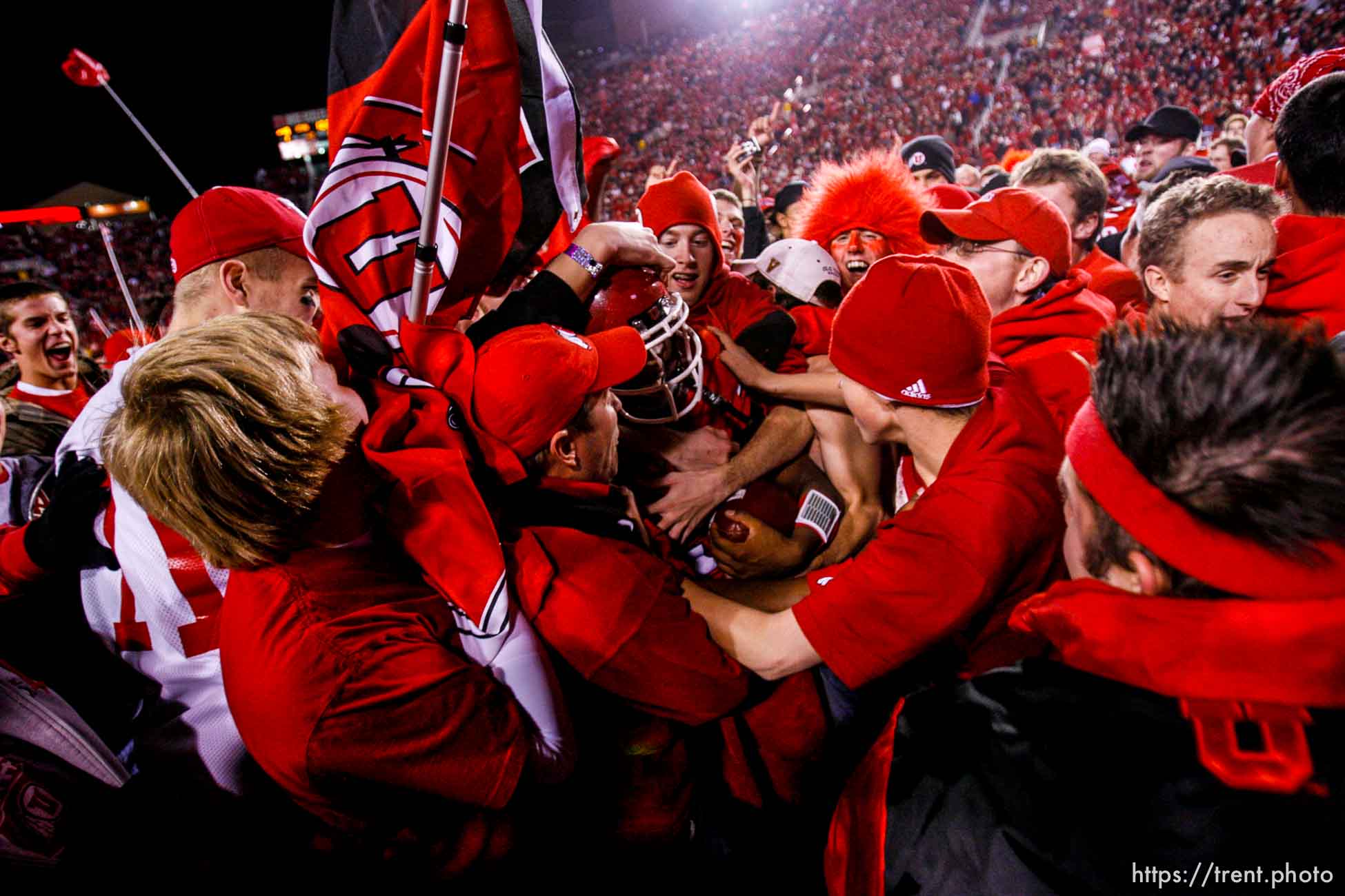 Salt Lake City - . Utah vs. BYU college football Saturday, November 22, 2008 at Rice-Eccles Stadium.  Saturday November 22, 2008. utah fans swarm the field. Utah quarterback Brian Johnson (3)