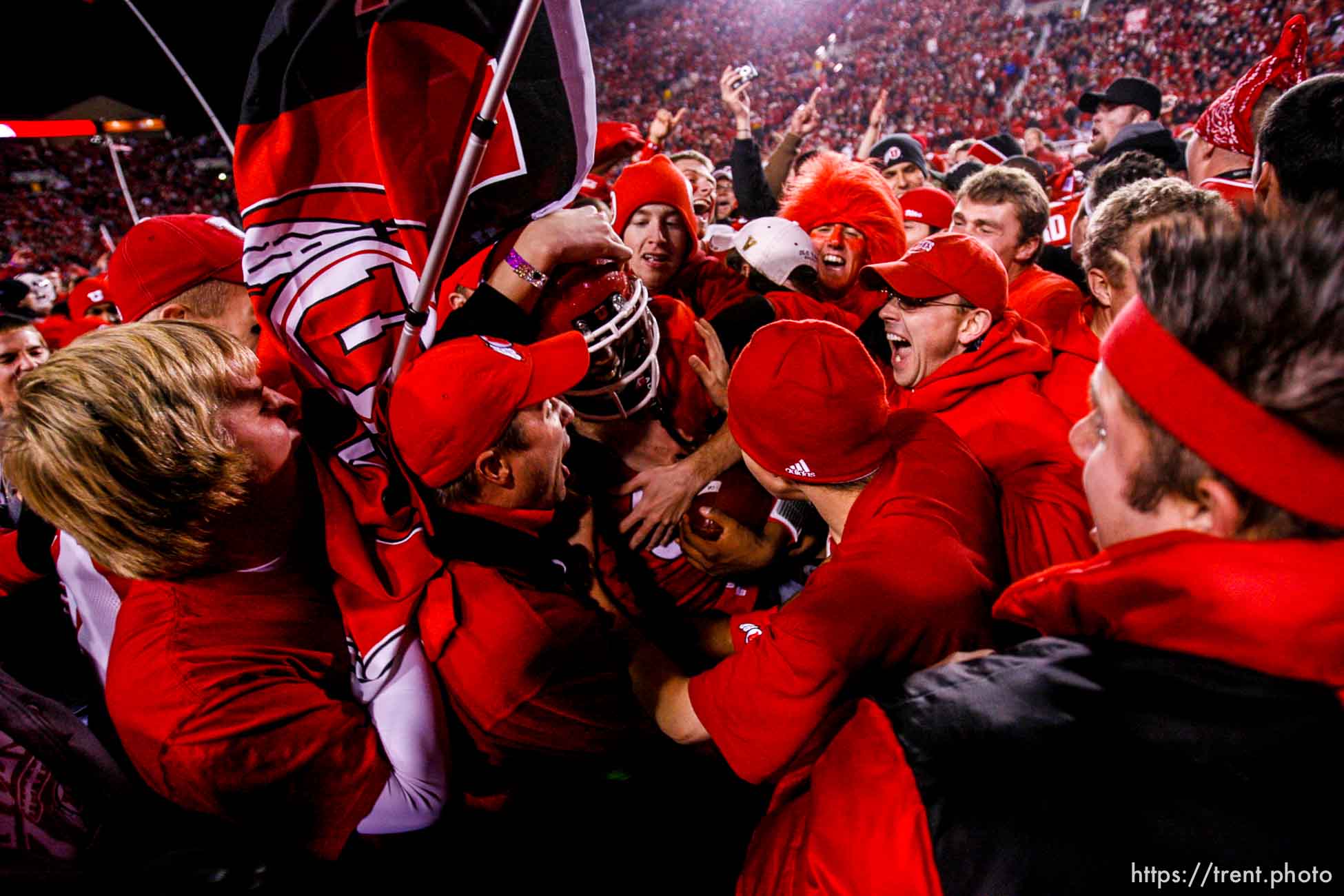 Salt Lake City - . Utah vs. BYU college football Saturday, November 22, 2008 at Rice-Eccles Stadium.  Saturday November 22, 2008. utah fans swarm the field. Utah quarterback Brian Johnson (3)