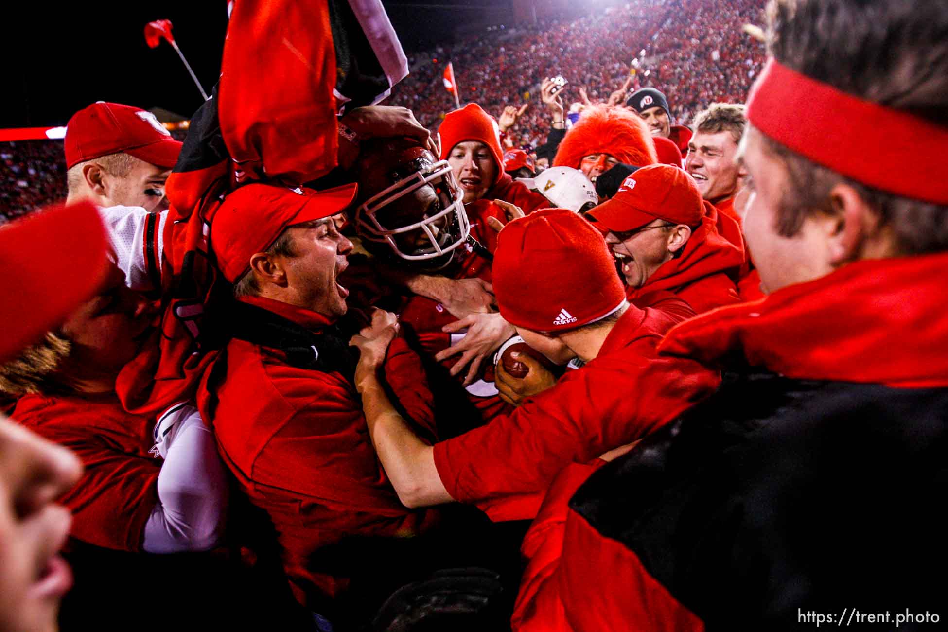 Salt Lake City - . Utah vs. BYU college football Saturday, November 22, 2008 at Rice-Eccles Stadium.  Saturday November 22, 2008. utah fans swarm the field. Utah quarterback Brian Johnson (3)