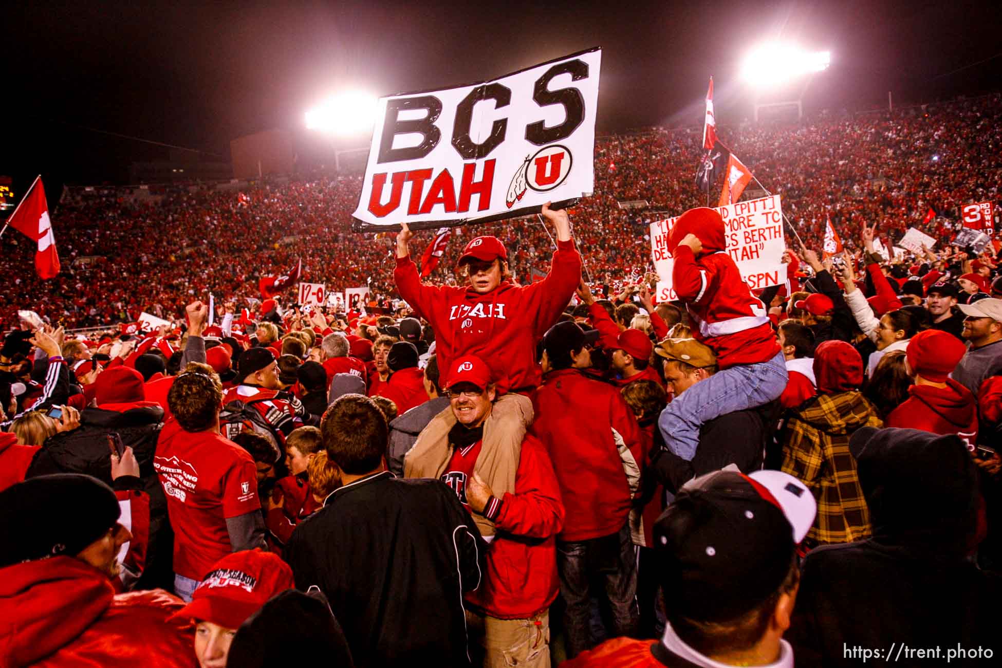 Salt Lake City - . Utah vs. BYU college football Saturday, November 22, 2008 at Rice-Eccles Stadium.  Saturday November 22, 2008. utah fans swarm the field. Utah quarterback Brian Johnson (3)