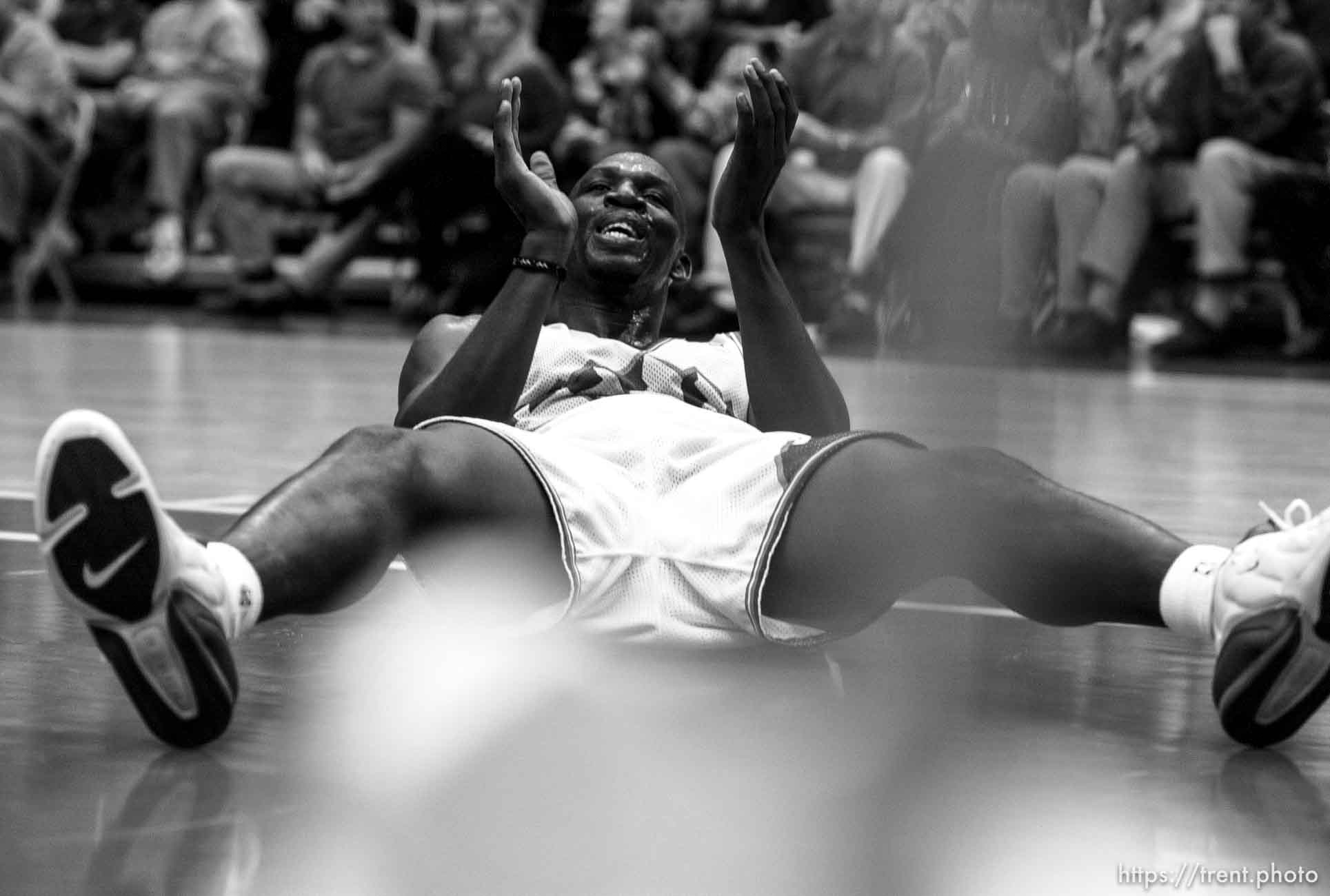 Olden Polynice on the floor, clapping a foul call at Utah Jazz vs. Los Angeles Clippers.