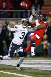 Las Vegas - at the Las Vegas Bowl, BYU vs. Arizona, college football Saturday December 20, 2008 at Sam Boyd Stadium. BYU WR Michael Reed (3) and Arizona defender Trevin Wade reach for a fourth quarter pass in the end zone