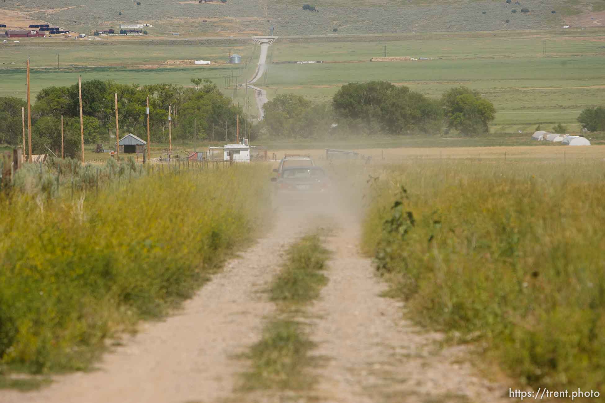 Washakie - Leland Pubigee, an elder in the Northwestern Band of the Shoshone, has died. This is the address of the North Stake Center (LDS), where his funeral will be. Leland will be buried at the Washakie Cemetery, an isolated dry patch that is part of the 400 acres the Northwestern Band has near the Idaho border, the last of its ancestral lands.  Saturday, July 18, 2009.
dirt road