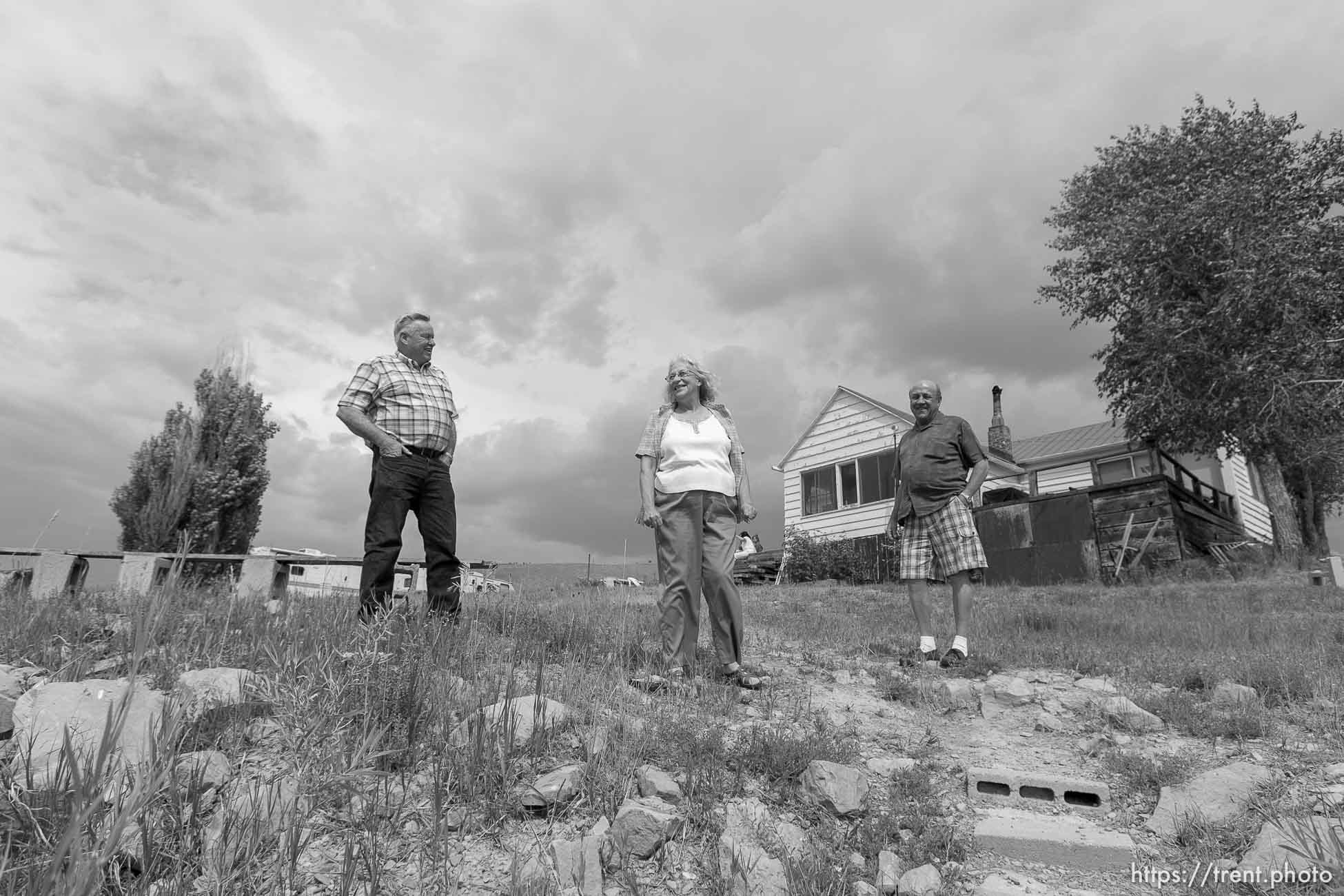 Scofield - People who have owned property and houses along the shores of the Scofield Reservoir for over 50 years are now being told by the federal government that they don't really own those places and must leave. The Mancina family could lose the cabin that's been in their family for over fifty years. Left to right, John Lamb, Judy Mancina Lamb, Paul Mancina, Thursday, September 3 2009.