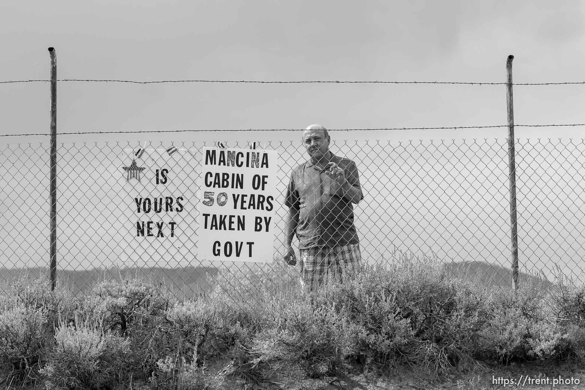 Scofield - People who have owned property and houses along the shores of the Scofield Reservoir for over 50 years are now being told by the federal government that they don't really own those places and must leave. The Mancina family could lose the cabin that's been in their family for over fifty years. Paul Mancina stnads by a sign on the entry to his familiy's property, Thursday, September 3 2009.