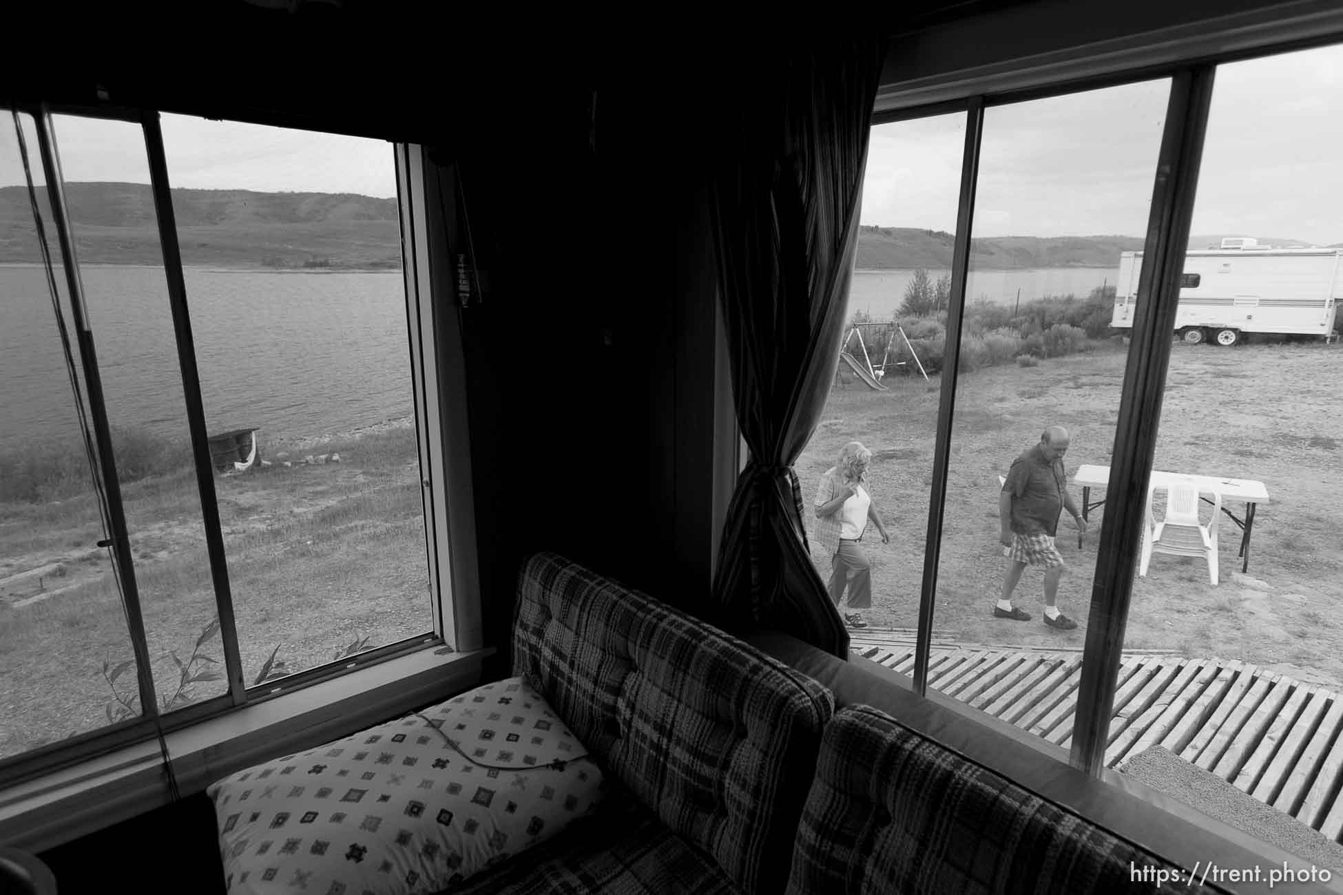 Scofield - People who have owned property and houses along the shores of the Scofield Reservoir for over 50 years are now being told by the federal government that they don't really own those places and must leave. The Mancina family could lose the cabin that's been in their family for over fifty years. Left to right, John Lamb, Judy Mancina Lamb, Paul Mancina, Thursday, September 3 2009.