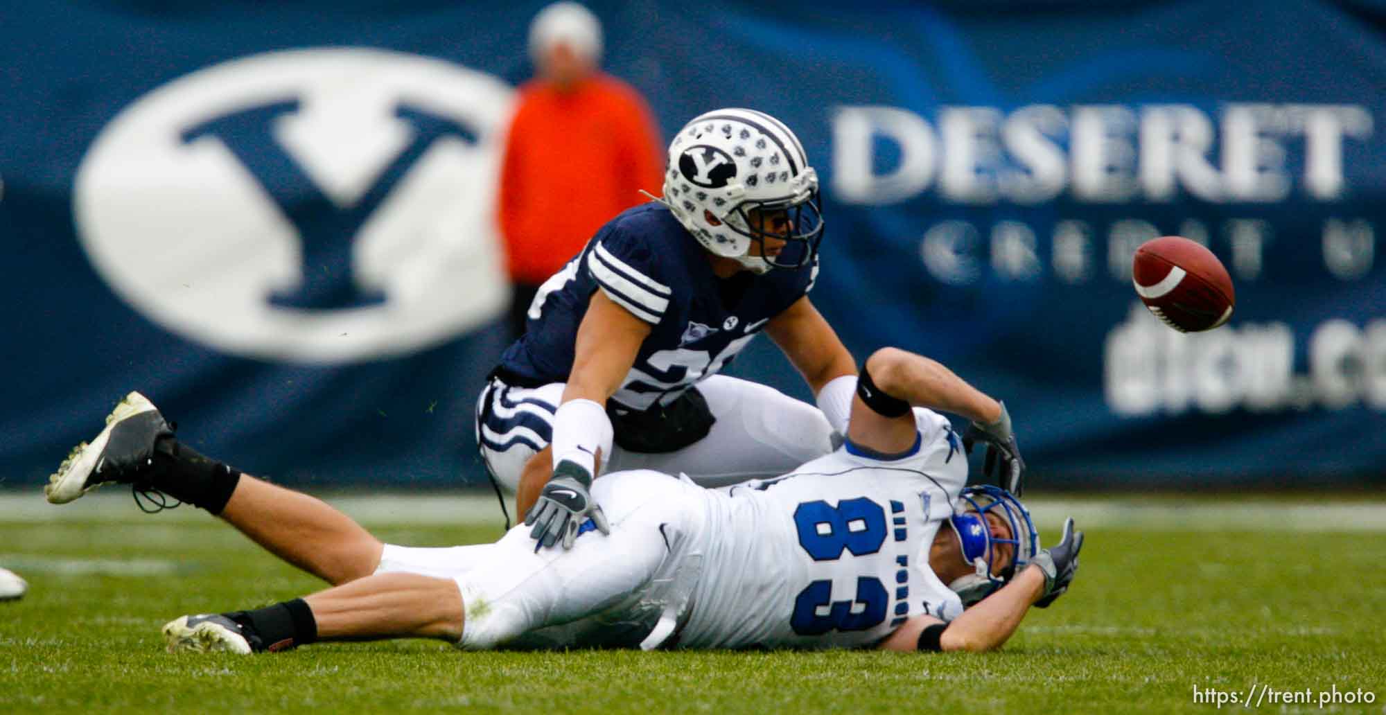 Trent Nelson  |  The Salt Lake Tribune
The ball gets away from Air Force's Kevin Fogler (83), with BYU's Lee Aguirre (20) defending. BYU vs. Air Force college football Saturday, November 21 2009.