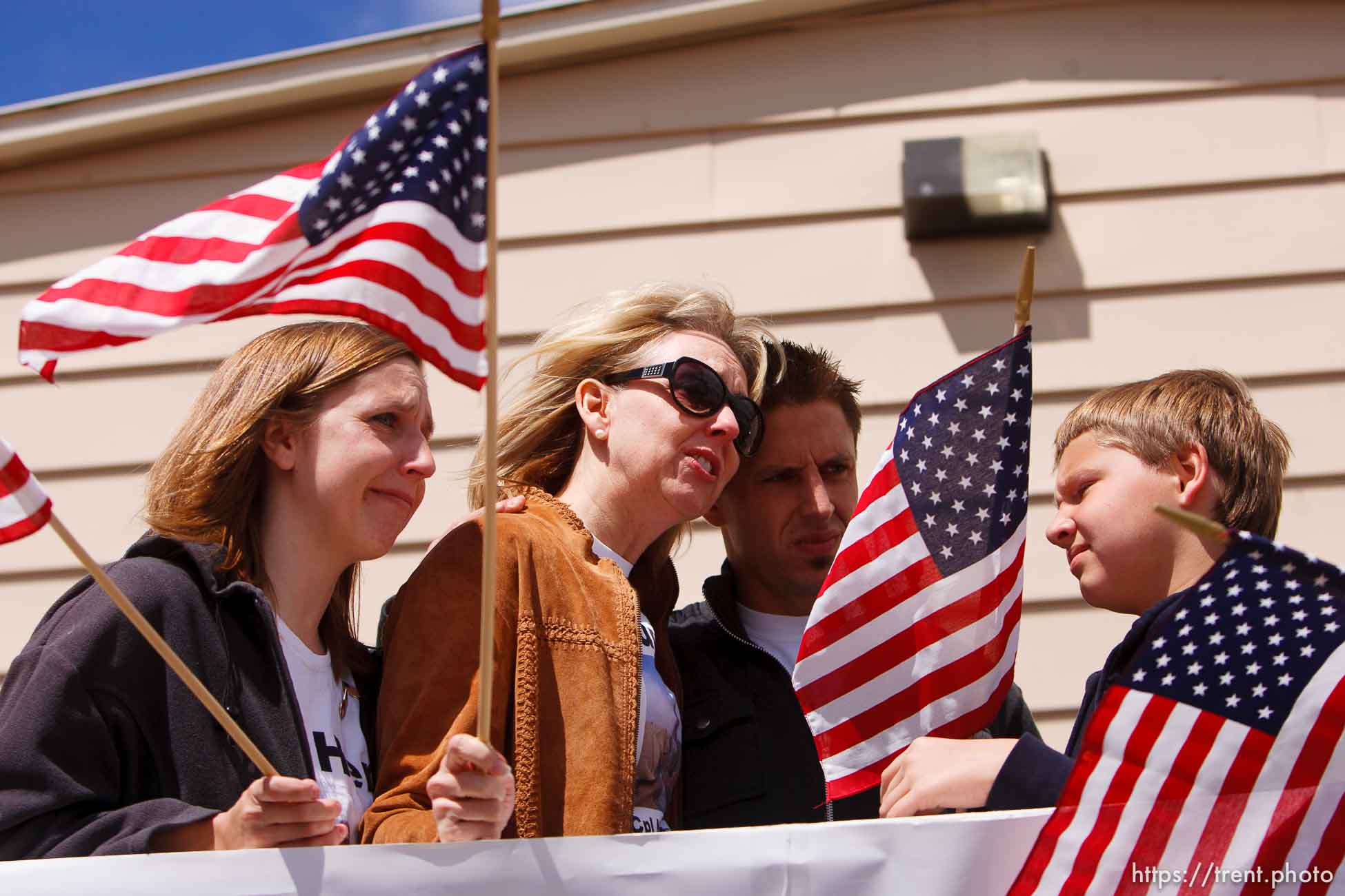 Trent Nelson  |  The Salt Lake Tribune
Bluffdale - The Marines of Charlie Company, 4th LAR, returned home from Afghanistan Saturday, May 29, 2010, without two of their brothers in arms. Although it was painful, the family of fallen Marine Nigel Olsen was at Camp Williams to meet them. left to right, Sarah Anthony (Nigel's  sister), Kim Olsen (mother), Quinn Olsen (brother) and Taylor Hansen (nephew).