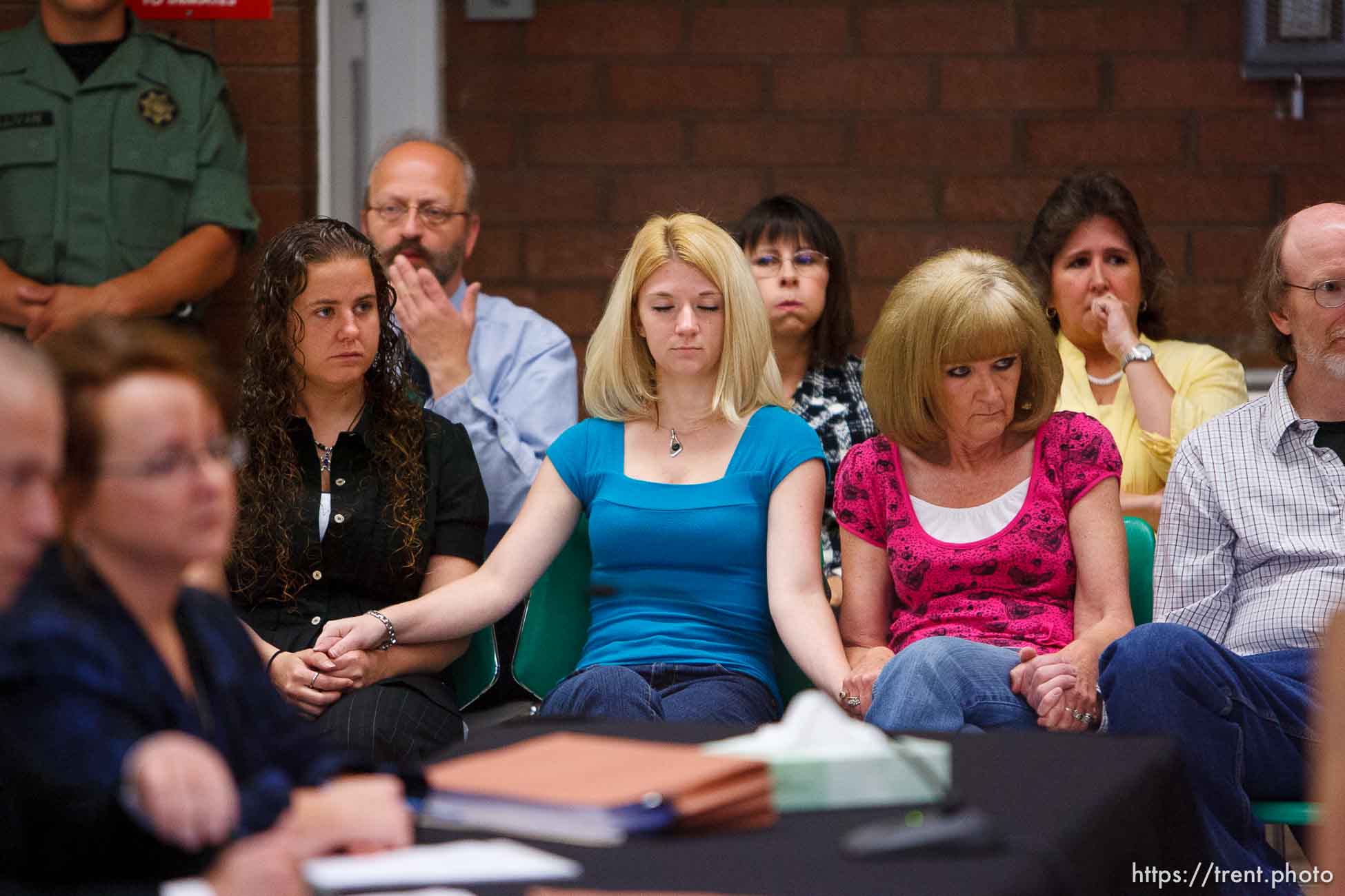 Trent Nelson  |  The Salt Lake Tribune
Draper - Family members of Nicolas G. Kirk, a deputy shot by Ronnie Lee Gardner, react as the Utah Board of Pardons and Parole announced their unanimous decision to deny Ronnie Lee Gardner's request for commutation Monday, June 14, 2010. He is scheduled to be executed by firing squad Friday. Left to right, front row, Jamie Stewart (granddaughter), Mandi Hull (granddaughter), Barb Webb (daughter). Left to right, back row, Doug Fawson (director of victim services, department of corrections), Tammie Atkin (victim advocate, Utah Attorney General's Office), Tami Stewart (daughter).