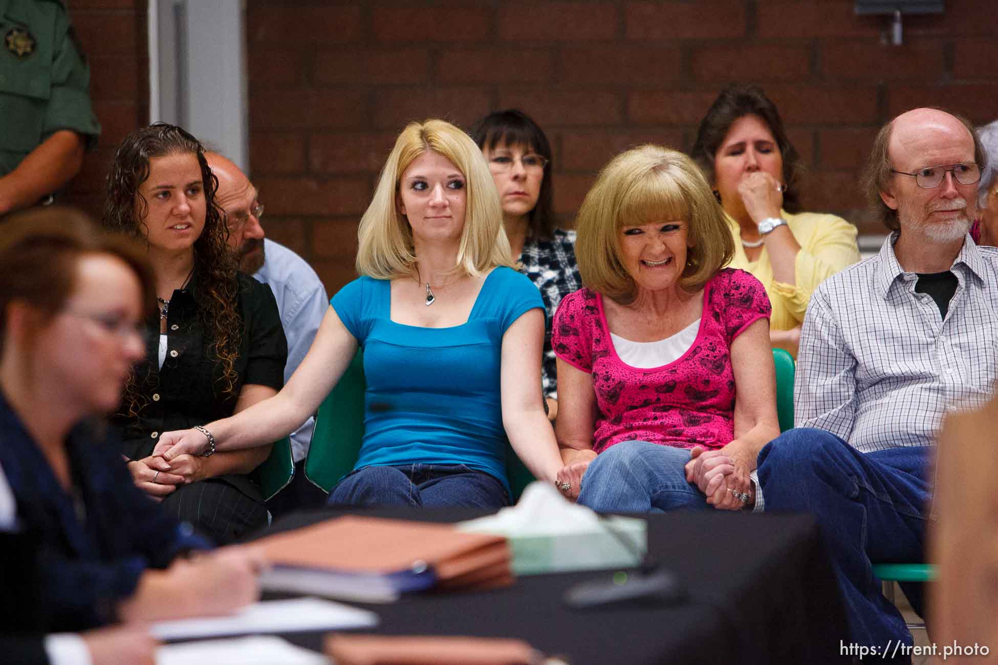 Trent Nelson  |  The Salt Lake Tribune
Draper - Family members of Nicolas G. Kirk, a deputy shot by Ronnie Lee Gardner, react as the Utah Board of Pardons and Parole announced their unanimous decision to deny Ronnie Lee Gardner's request for commutation Monday, June 14, 2010. He is scheduled to be executed by firing squad Friday. Left to right, front row, Jamie Stewart (granddaughter), Mandi Hull (granddaughter), Barb Webb (daughter). Left to right, back row, Doug Fawson (director of victim services, department of corrections), Tammie Atkin (victim advocate, Utah Attorney General's Office), Tami Stewart (daughter).