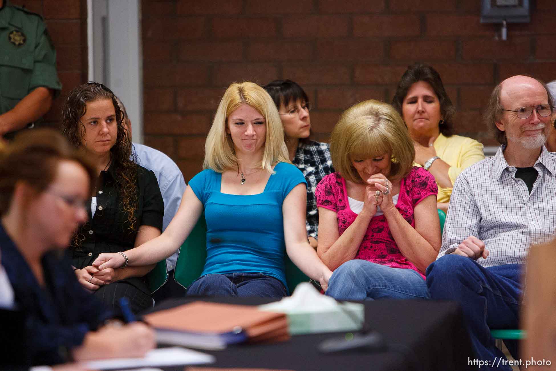 Trent Nelson  |  The Salt Lake Tribune
Draper - Family members of Nicolas G. Kirk, a deputy shot by Ronnie Lee Gardner, react as the Utah Board of Pardons and Parole announced their unanimous decision to deny Ronnie Lee Gardner's request for commutation Monday, June 14, 2010. He is scheduled to be executed by firing squad Friday. Left to right, front row, Jamie Stewart (granddaughter), Mandi Hull (granddaughter), Barb Webb (daughter). Left to right, back row, Doug Fawson (director of victim services, department of corrections), Tammie Atkin (victim advocate, Utah Attorney General's Office), Tami Stewart (daughter).