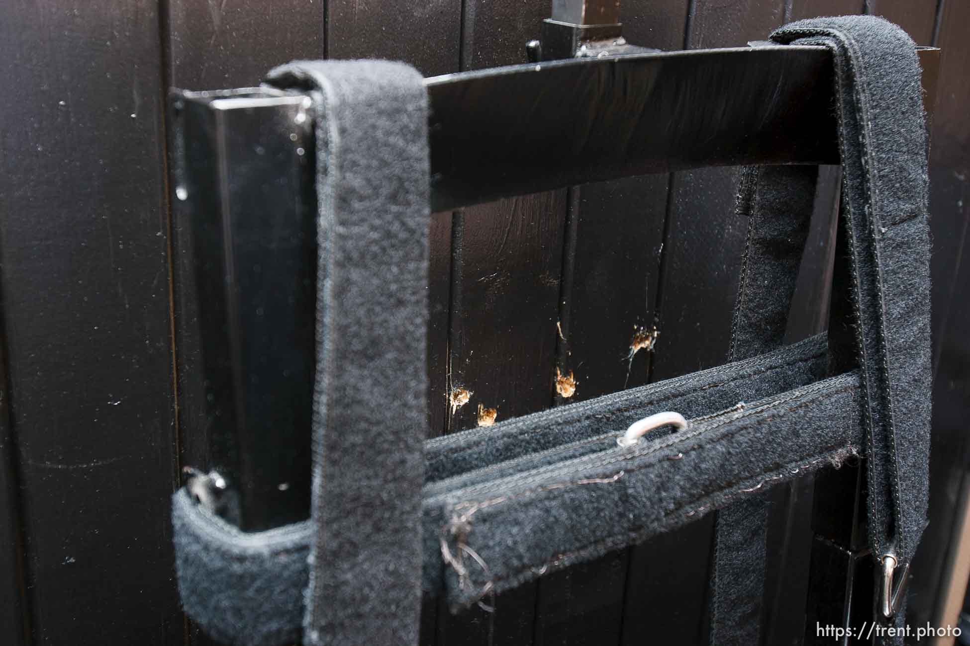 Trent Nelson  |  The Salt Lake Tribune
Draper - The execution chamber at the Utah State Prison after Ronnie Lee Gardner was executed by firing squad Friday, June 18, 2010. Four bullet holes are visible in the wood panel behind the chair. Gardner was convicted of aggravated murder, a capital felony, in 1985.