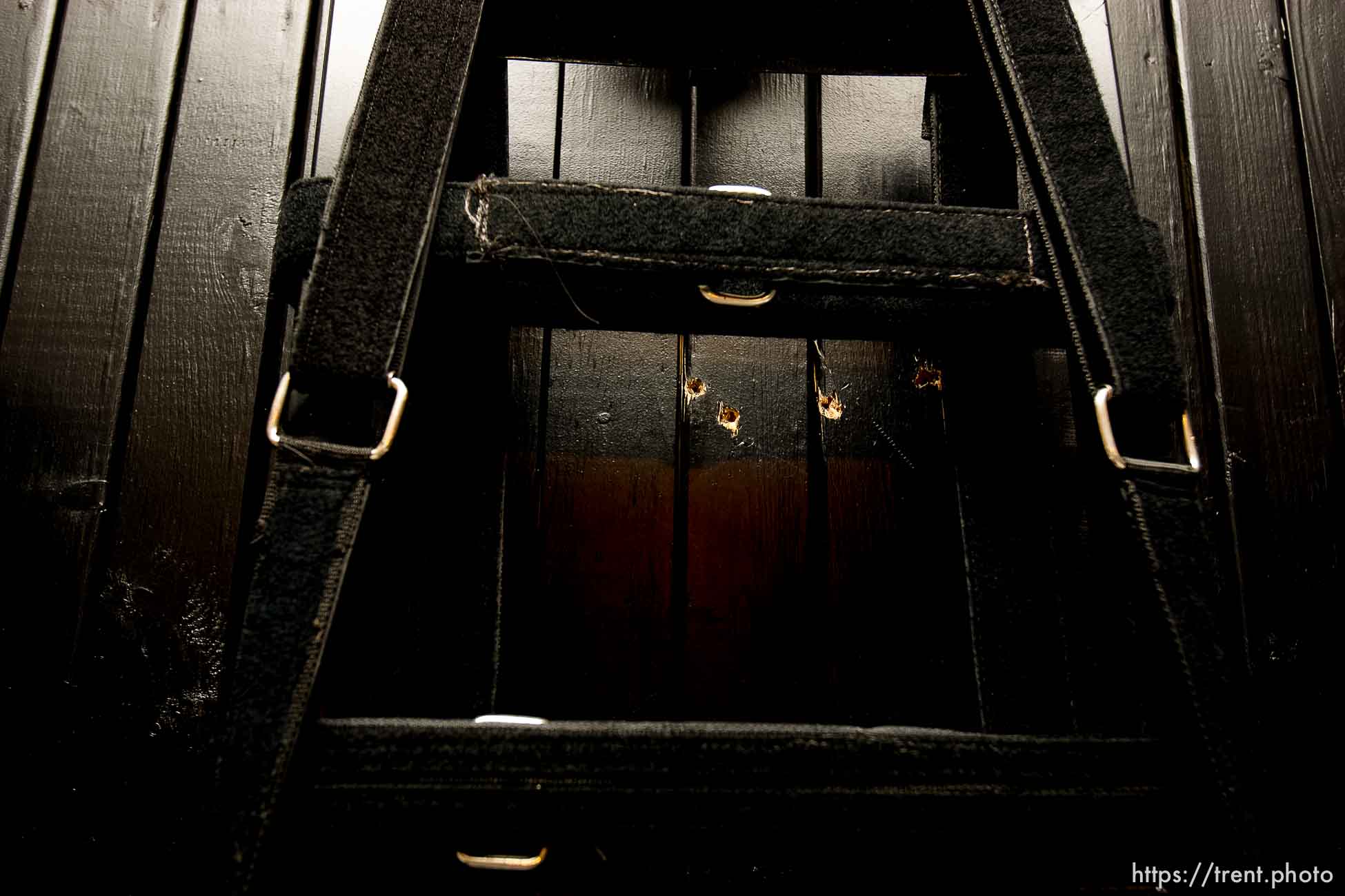 Trent Nelson  |  The Salt Lake Tribune
Draper - The execution chamber at the Utah State Prison after Ronnie Lee Gardner was executed by firing squad Friday, June 18, 2010. Four bullet holes are visible in the wood panel behind the chair. Gardner was convicted of aggravated murder, a capital felony, in 1985.