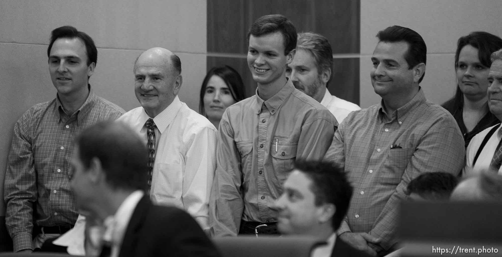 Trent Nelson  |  The Salt Lake Tribune
In the gallery, people stand to show honor and respect to Warren Jeffs, leader of the FLDS Church, appeared before Judge Terry Christiansen in Third District Court  Tuesday, September 7, 2010 in West Jordan, Utah. guy nielsen, wendell nielsen, mosiah jeffs, john wayman, merril jessop. back row gary batchelor and heidi mattingly foster