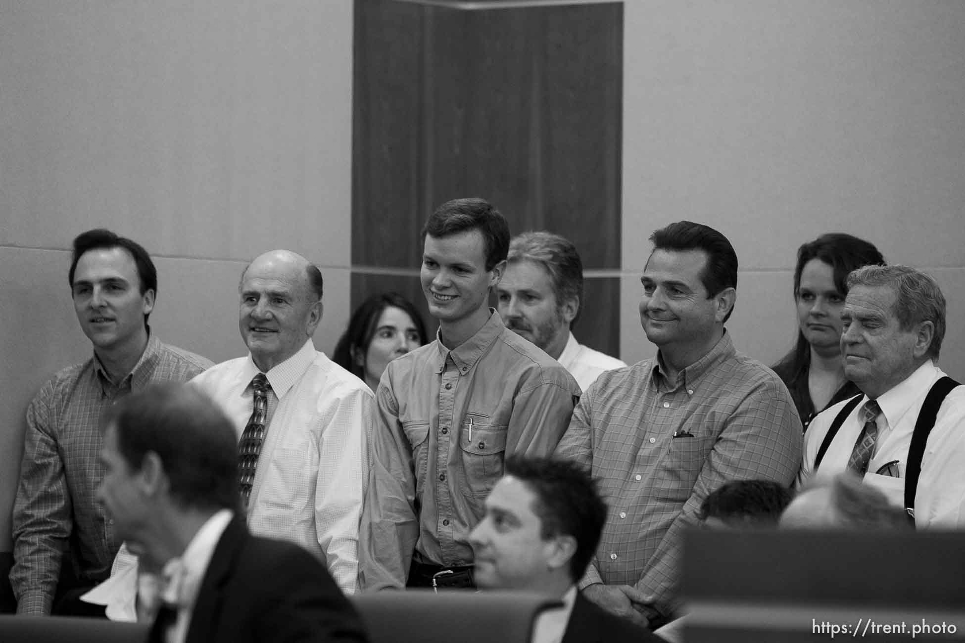 Trent Nelson  |  The Salt Lake Tribune
In the gallery, people stand to show honor and respect to Warren Jeffs, leader of the FLDS Church, appeared before Judge Terry Christiansen in Third District Court  Tuesday, September 7, 2010 in West Jordan, Utah. guy nielsen, wendell nielsen, mosiah jeffs, john wayman, merril jessop. back row gary batchelor and heidi mattingly foster