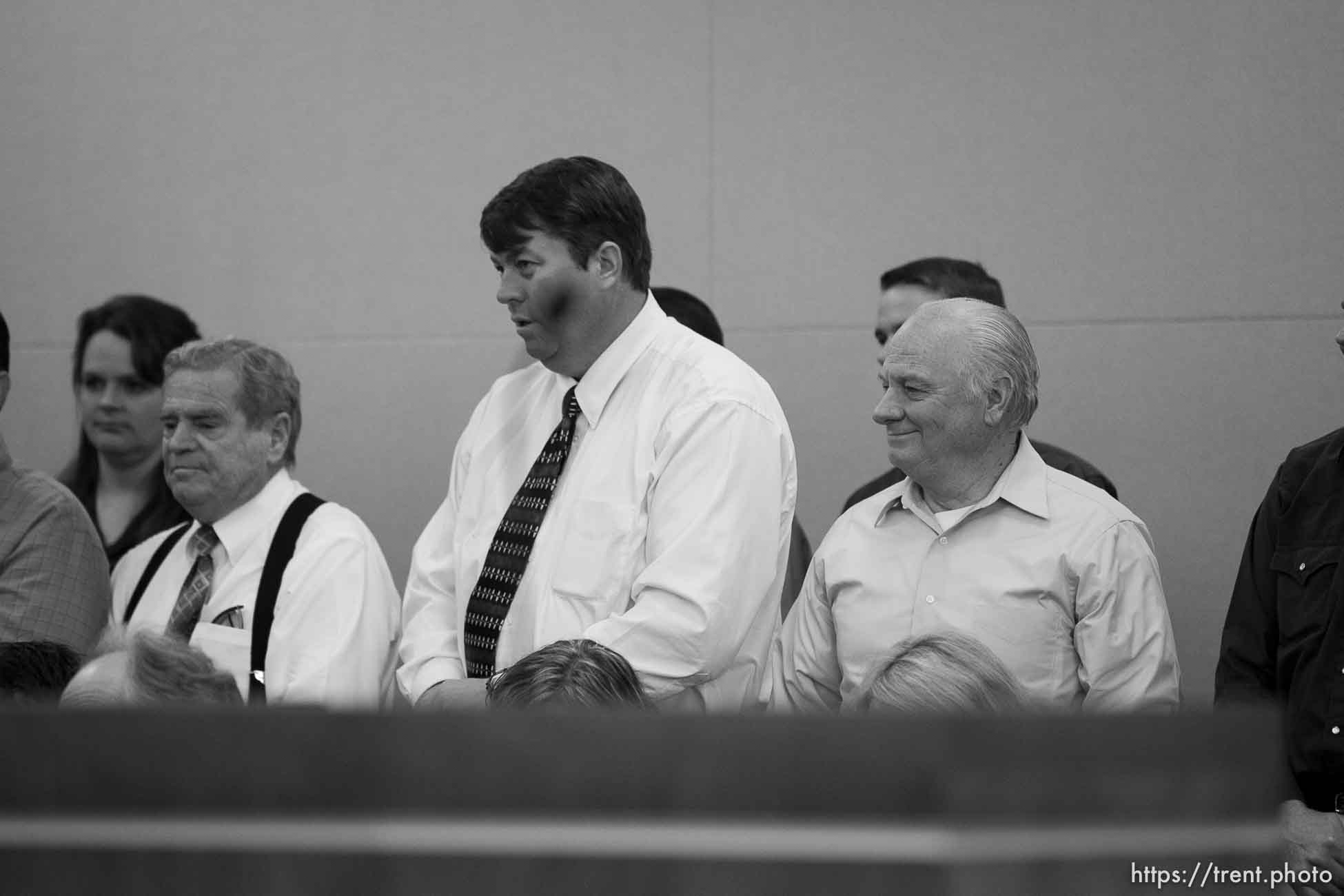 Trent Nelson  |  The Salt Lake Tribune
In the gallery, people stand to show honor and respect to Warren Jeffs, leader of the FLDS Church, appeared before Judge Terry Christiansen in Third District Court  Tuesday, September 7, 2010 in West Jordan, Utah. merril jessop, willie jessop