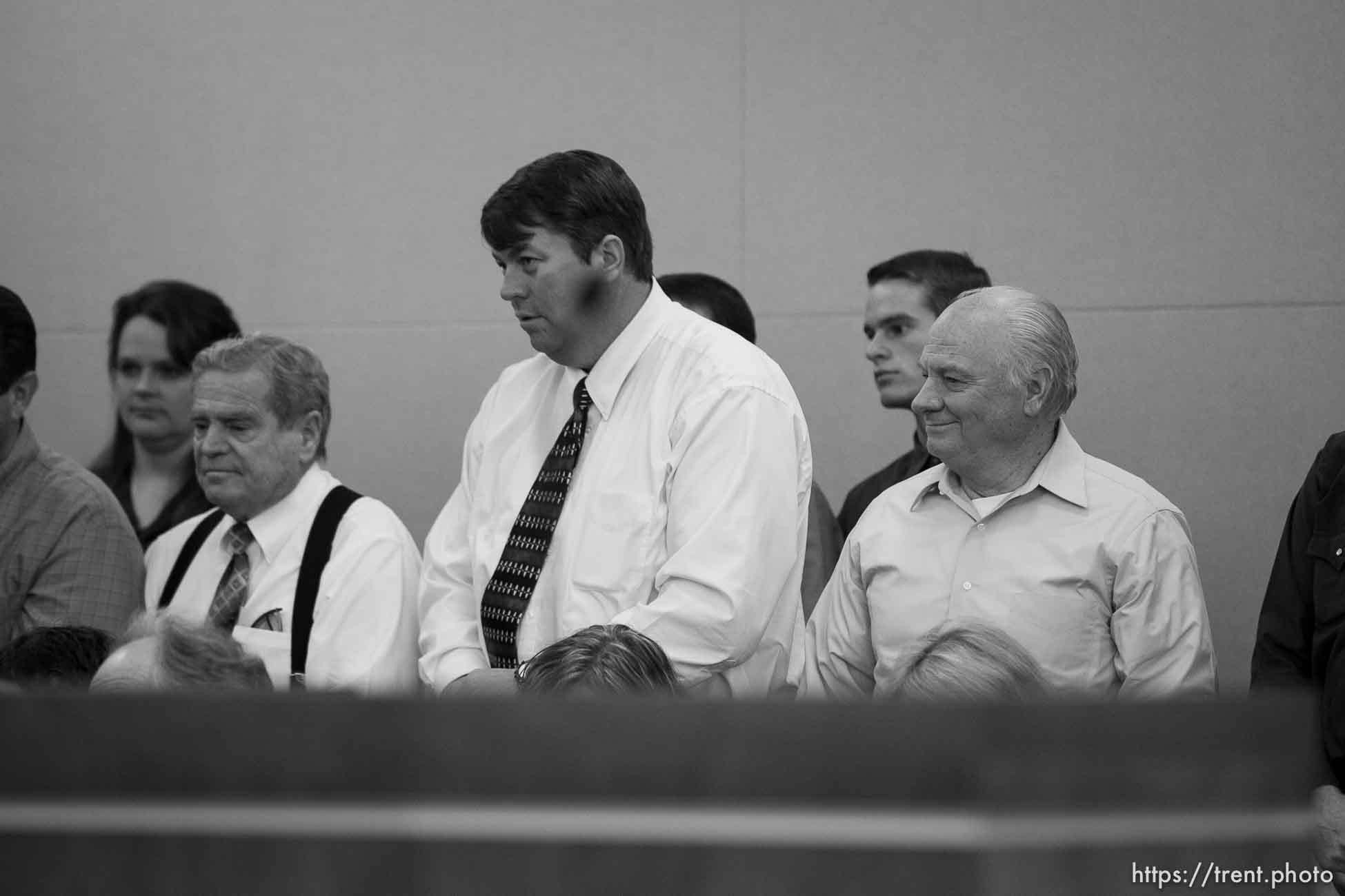 Trent Nelson  |  The Salt Lake Tribune
In the gallery, people stand to show honor and respect to Warren Jeffs, leader of the FLDS Church, appeared before Judge Terry Christiansen in Third District Court  Tuesday, September 7, 2010 in West Jordan, Utah. merril jessop, willie jessop