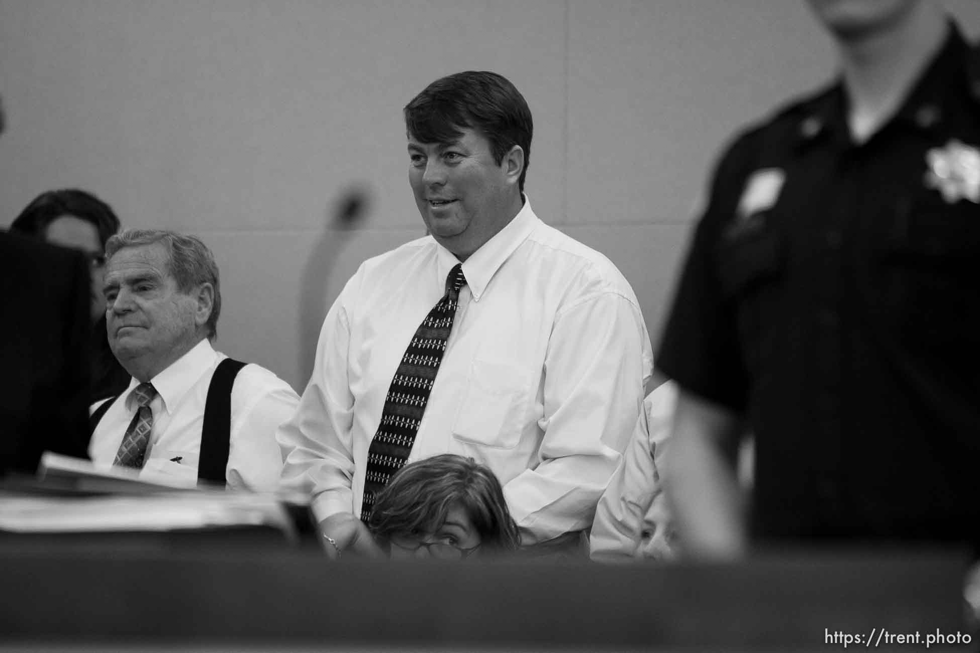 Trent Nelson  |  The Salt Lake Tribune
Followers of polygamist leader Warren Jeffs (Merril Jessop at left, Willie Jessop at center) stand as he is led out of the courtroom. Jeffs, the leader of the FLDS Church, appeared before Judge Terry Christiansen in Third District Court Tuesday, September 7, 2010 in West Jordan, Utah.