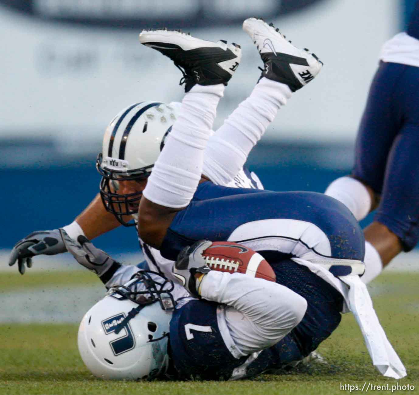 Trent Nelson  |  The Salt Lake Tribune
Utah State's Chris Randle rolls to a stop after intercepting a pass from BYU quarterback Jake Heaps. Utah State vs. BYU college football in Logan Friday, October 1, 2010.