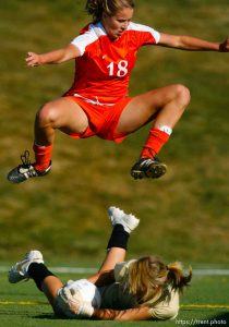 Trent Nelson  |  The Salt Lake Tribune
Brighton's Kassidy Kellogg leaps over Davis goalkeeper Danielle MacKay. Davis vs. Brighton high school, 5A girls' soccer state championships semifinals at Juan Diego High School Tuesday, October 19, 2010