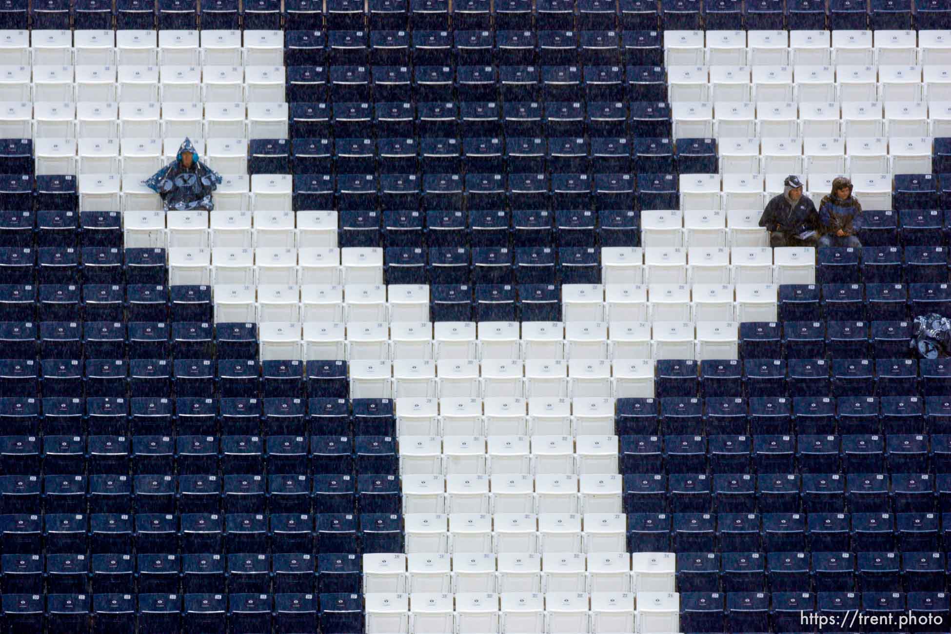 Trent Nelson  |  The Salt Lake Tribune
BYU football fans sit in the rain awaiting the start of the BYU vs. Wyoming college football game Saturday, October 23, 2010 at LaVell Edwards Stadium in Provo.