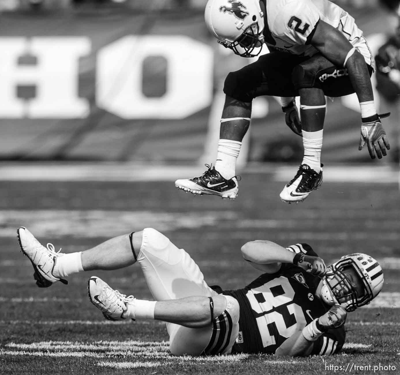 Trent Nelson  |  The Salt Lake Tribune
Wyoming's Marcell Gipson flies over BYU tight end Mike Muehlmann (82), who had just dropped a pass in the second quarter. BYU vs. Wyoming, college football Saturday, October 23, 2010 at LaVell Edwards Stadium in Provo.