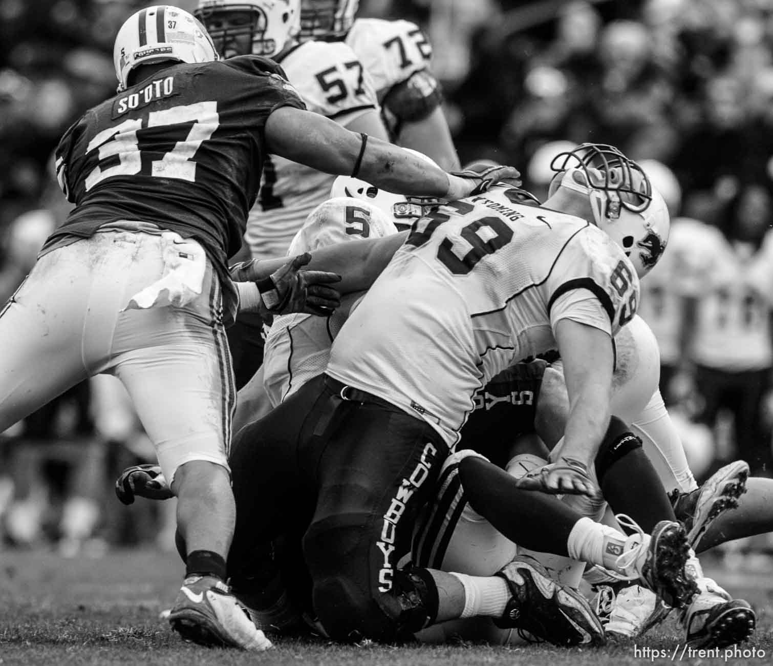 Trent Nelson  |  The Salt Lake Tribune
BYU defensive lineman Vic So'oto (37) pushes over Wyoming's John Hutchins during the second half, BYU vs. Wyoming, college football Saturday, October 23, 2010 at LaVell Edwards Stadium in Provo. BYU won 25-20.