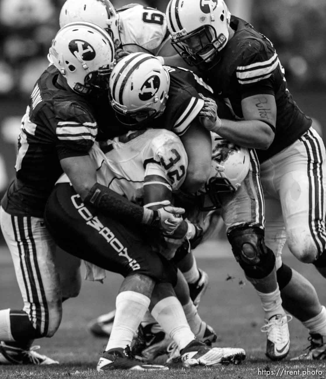 Trent Nelson  |  The Salt Lake Tribune
A trio of BYU defenders bring down Wyoming's Alvester Alexander during the second half, BYU vs. Wyoming, college football Saturday, October 23, 2010 at LaVell Edwards Stadium in Provo. BYU won 25-20.