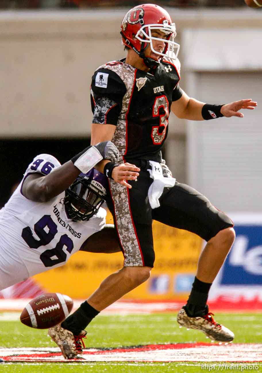 Trent Nelson  |  The Salt Lake Tribune
TCU's Wayne Daniels strips the ball from Utah quarterback Jordan Wynn during the first half, leading to a TCU touchdown. Utah vs. TCU college football, Saturday, November 6, 2010.