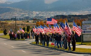 Trent Nelson  |  The Salt Lake Tribune
Eagle Mountain City, family, and neighbors will welcome home one of our resident heroes on Friday, November 12 beginning at 2:30 PM. SFC Mike Jones, with the Utah National Guard, was injured in Afghanistan in September during his fourth deployment in the War on Terror when his vehicle was hit by an Improvised Explosive Device (IED). SFC Jones suffered a traumatic brain injury and has been convalescing at Ft. Lewis, Washington. Eagle Mountain City traditionally holds a welcome home procession when our soldiers return from deployment. The soldier and his family are led in a convoy through the city by our fire and sheriff’s department, accompanied by Mayor Heather Jackson, down a route lined with flags and yellow ribbons. Community members are invited to stand along the route to wave and cheer. The welcome home procession tradition began with a suggestion by Kindra Jones, the wife of SFC Jones, three years ago. In 2009, Mrs. Jones received the city’s Community Hero Award for her work with veterans and for inspiring the creation of the city’s Yellow Ribbon Committee., Friday, November 12, 2010.