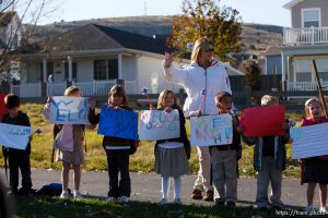 Trent Nelson  |  The Salt Lake Tribune
SFC Mike Jones, Utah National Guard, was welcomed home to Eagle Mountain by family, friends and neighbors who lined the streets of Eagle Mountain Friday, November 12, 2010. On his fourth deployment, Jones was injured in Afghanistan in September.