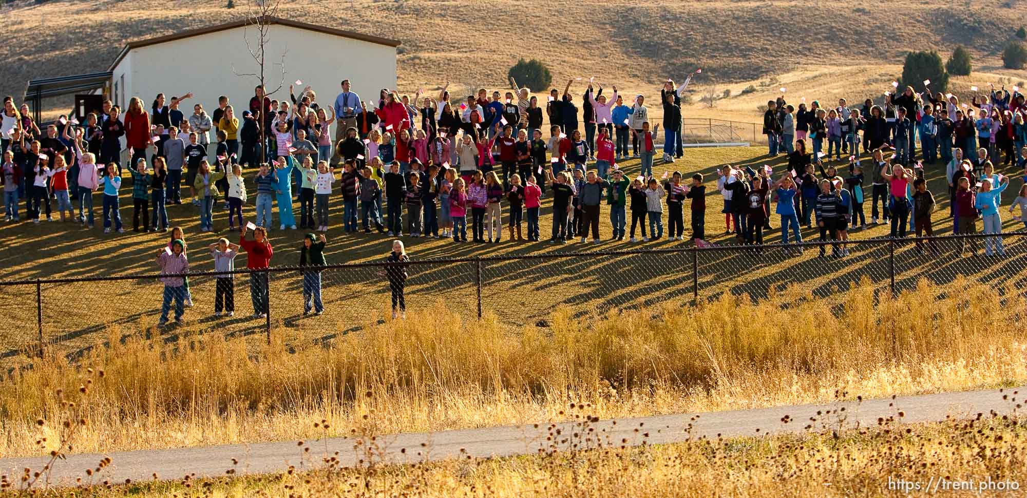 Trent Nelson  |  The Salt Lake Tribune
Eagle Mountain City, family, and neighbors will welcome home one of our resident heroes on Friday, November 12 beginning at 2:30 PM. SFC Mike Jones, with the Utah National Guard, was injured in Afghanistan in September during his fourth deployment in the War on Terror when his vehicle was hit by an Improvised Explosive Device (IED). SFC Jones suffered a traumatic brain injury and has been convalescing at Ft. Lewis, Washington. Eagle Mountain City traditionally holds a welcome home procession when our soldiers return from deployment. The soldier and his family are led in a convoy through the city by our fire and sheriff’s department, accompanied by Mayor Heather Jackson, down a route lined with flags and yellow ribbons. Community members are invited to stand along the route to wave and cheer. The welcome home procession tradition began with a suggestion by Kindra Jones, the wife of SFC Jones, three years ago. In 2009, Mrs. Jones received the city’s Community Hero Award for her work with veterans and for inspiring the creation of the city’s Yellow Ribbon Committee., Friday, November 12, 2010.