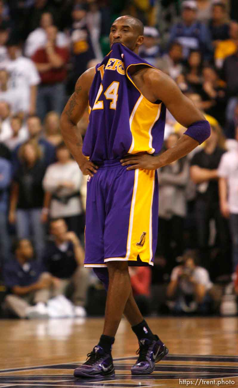 Trent Nelson  |  The Salt Lake Tribune
Los Angeles Lakers guard Kobe Bryant (24) with his jersey in his mouth as time runs out on the Lakers. Utah Jazz vs. Los Angeles Lakers, NBA basketball Friday, November 26, 2010 at EnergySolutions Arena.