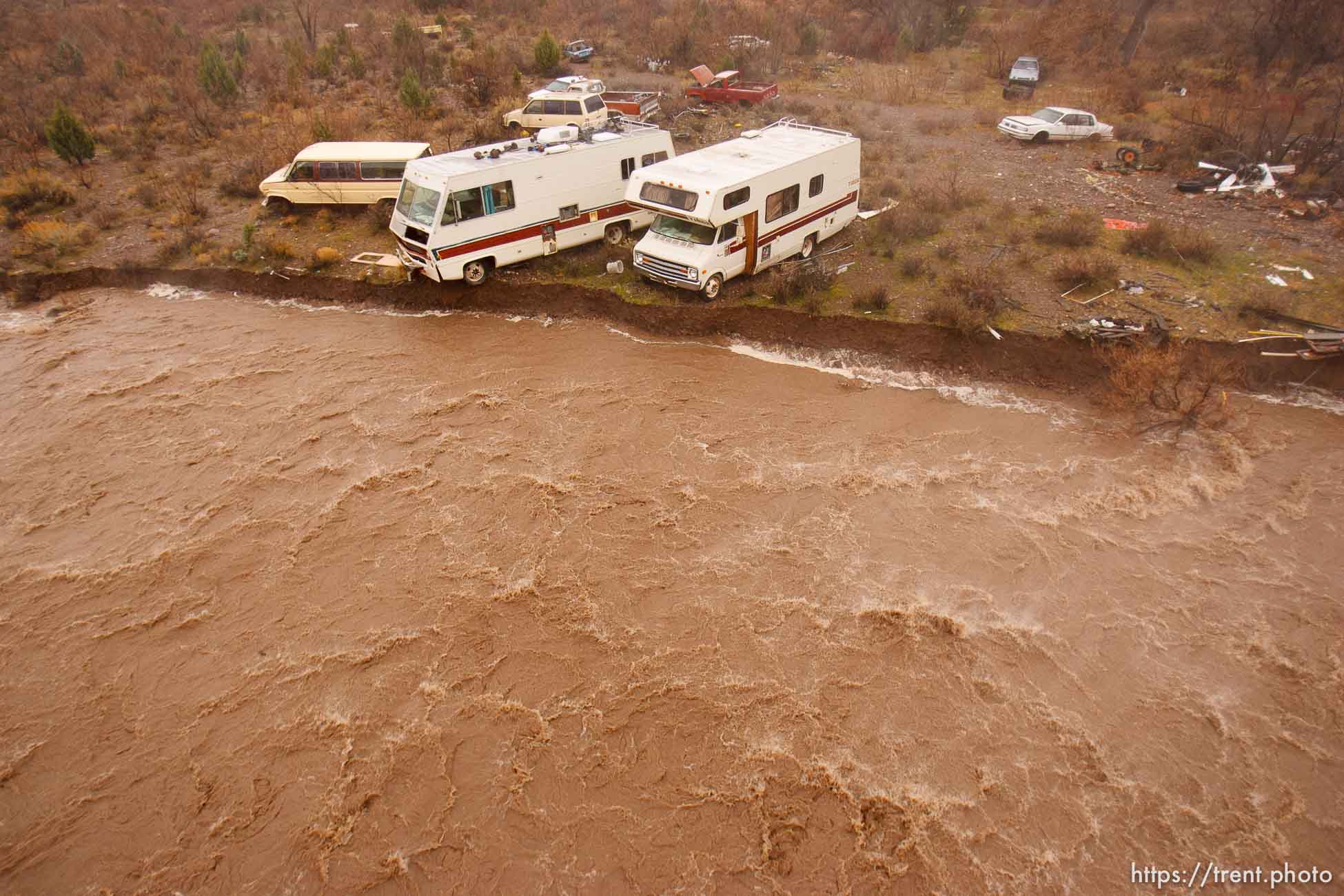 Trent Nelson  |  The Salt Lake Tribune
Recreational vehicles in a precarious position on the edge of Beaver Dam Wash in Motoqua, Utah, Wednesday, December 22, 2010.