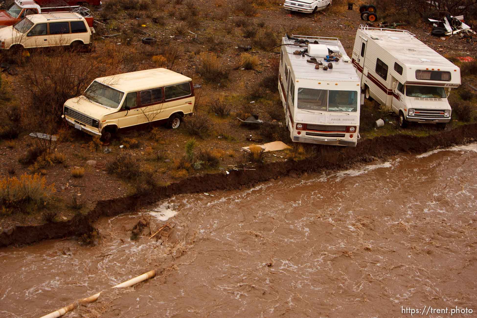 Trent Nelson  |  The Salt Lake Tribune
Recreational vehicles in a precarious position on the edge of Beaver Dam Wash in Motoqua, Utah, Wednesday, December 22, 2010.