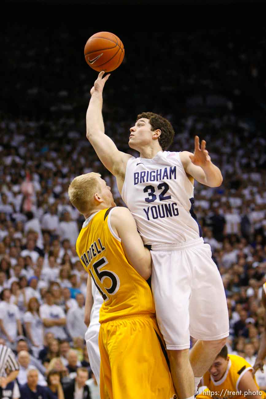 Trent Nelson  |  The Salt Lake Tribune
BYU's Jimmer Fredette shoots over Wyoming's Adam Waddell as BYU hosts Wyoming, college basketball in Provo, Utah, Saturday, March 5, 2011.