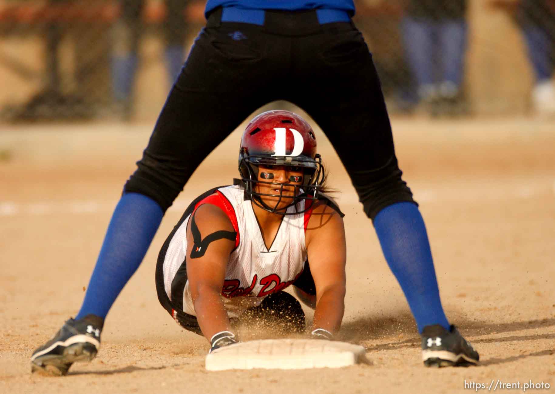 Trent Nelson  |  The Salt Lake Tribune
Grand County's Nikita Nelson dives into second as San Juan's Kelsi Meyer waits for the ball. San Juan defeats Grand County High School 3-1 in 2A girls softball, in Spanish Fork, Utah, Friday, May 13, 2011.