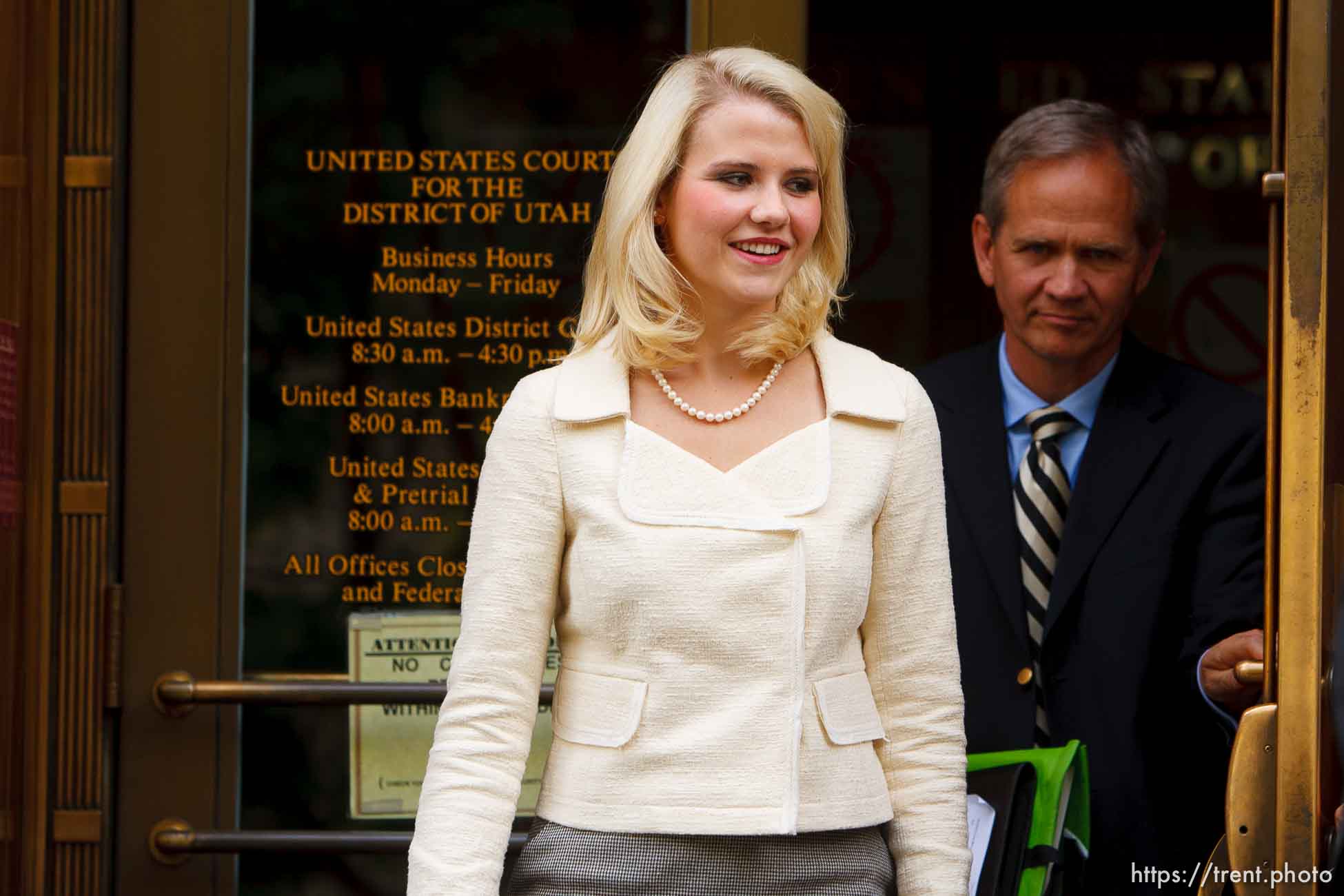 Ed and Elizabeth Smart exit the Frank E. Moss Courthouse after Brian David Mitchell was sentenced to life in prison for his role in the kidnapping of Elizabeth Smart, in Salt Lake City, Utah, Wednesday, May 25, 2011.