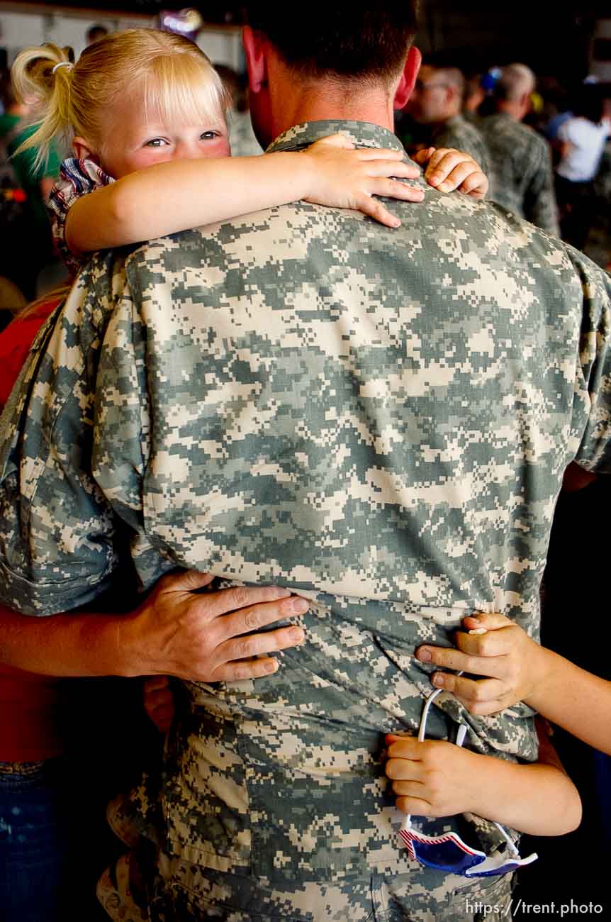 Trent Nelson  |  The Salt Lake Tribune
Macy Yoder, 4, embraces her uncle Sgt Shawn Yoder, as the Utah National Guard's 141st Military Intelligence Battalion returned to Salt Lake City, Utah, from duty in Iraq Wednesday, June 15, 2011. Some 275 soldiers of the 141st deployed in June last year.