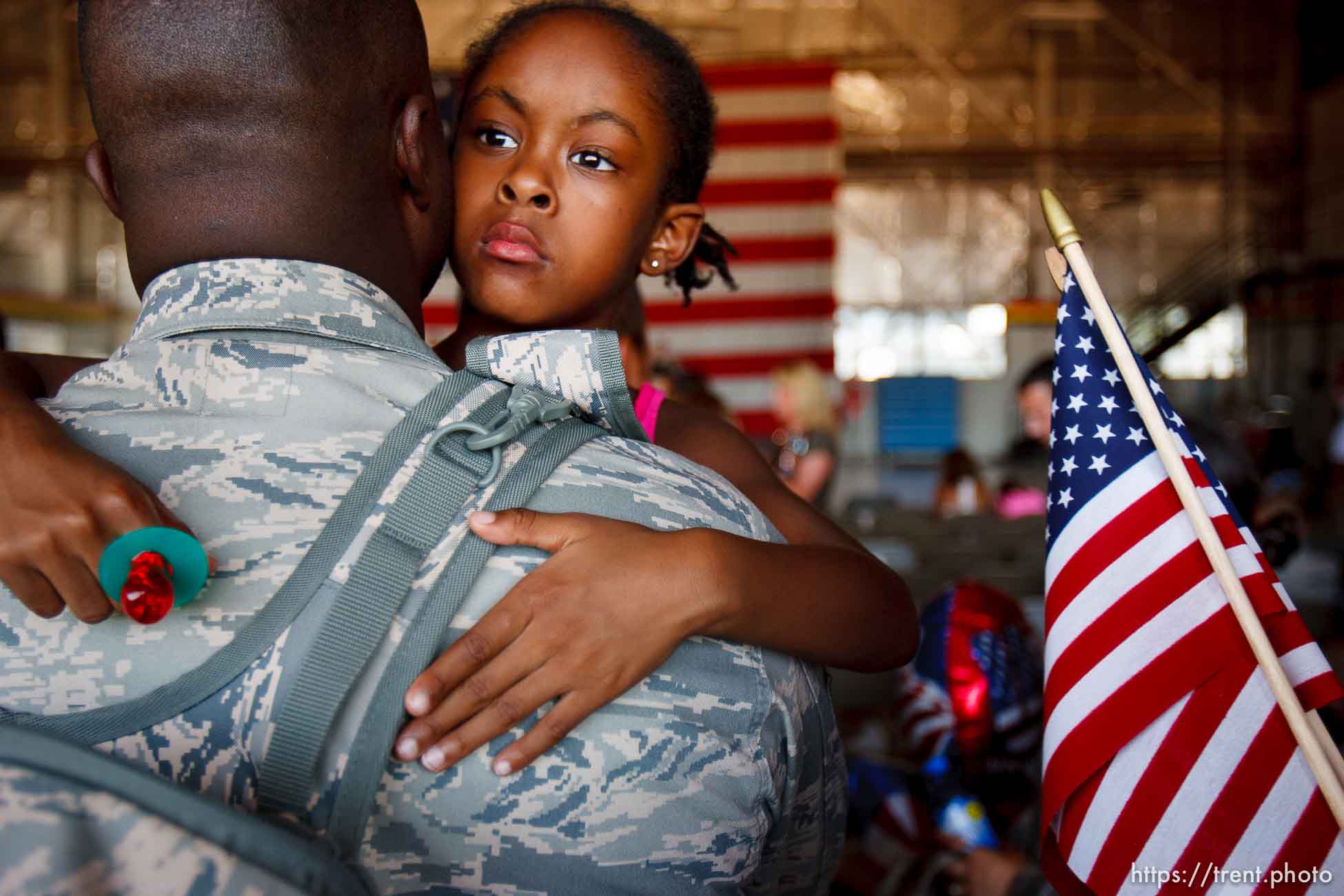 Trent Nelson  |  The Salt Lake Tribune
Tech Sergeant Robert Johnson holds his daughter Anaya after the 729th Air Control Squadron returned to Hill Air Force Base in Layton, Utah, after six months in Afghanistan Wednesday, July 20, 2011.
